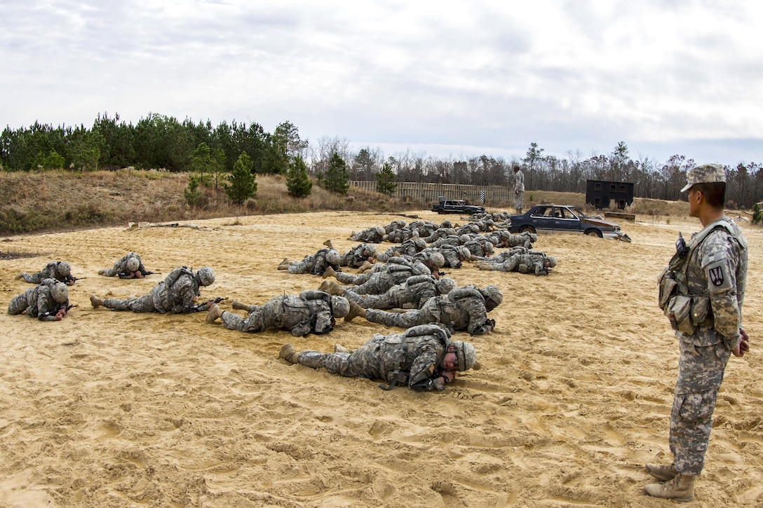 Soldiers rehearse individual movement techniques in preparation for night infiltration training on Fort Jackson, S.C., Dec. 3, 2015. U.S. Army photo by Sgt. 1st Class Brian Hamilton