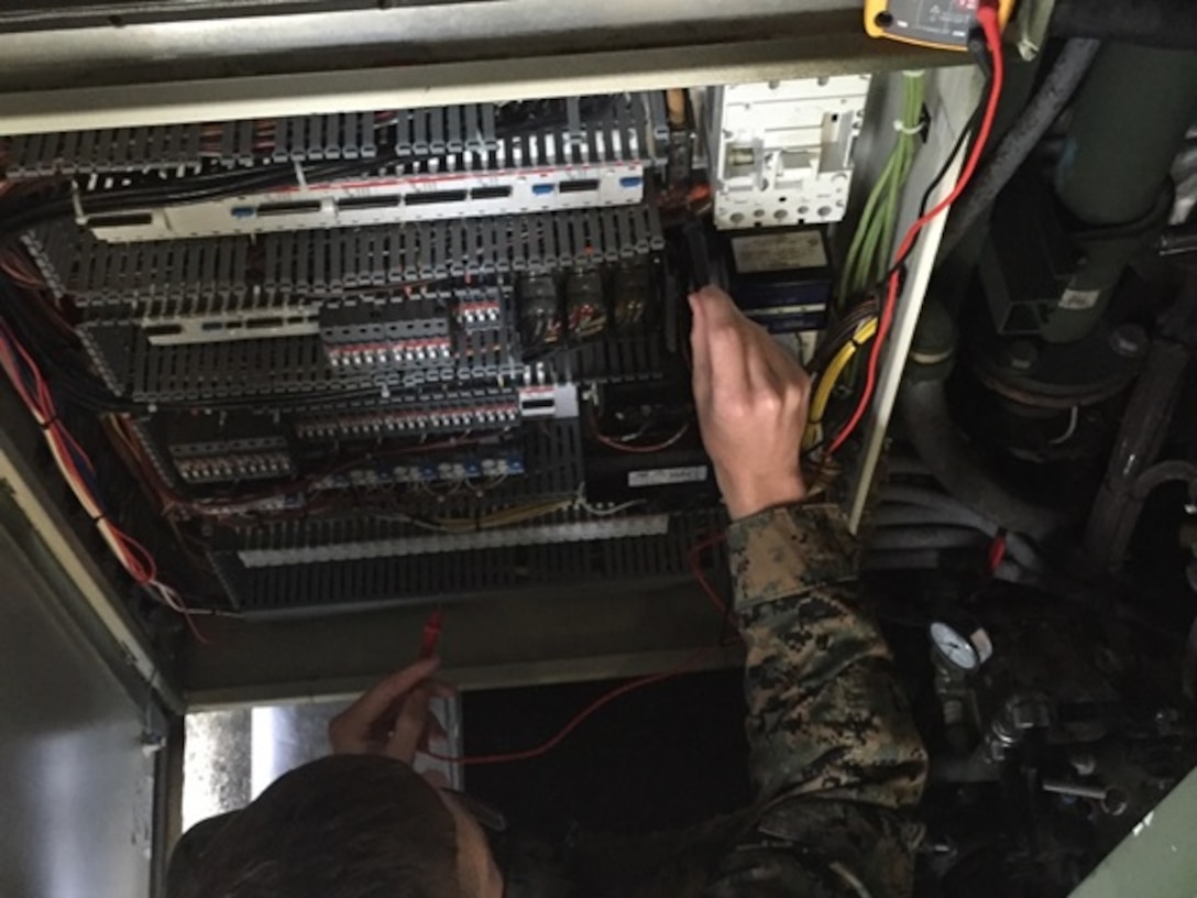 Marines attending the Advanced Water Support Technician course 1-16 (AWST 1-16) aboard Courthouse Bay, Camp Lejeune, N.C., conduct practical application exercises on trouble shooting common errors within a power distribution panel.  These exercises reinforce classroom knowledge and increase the Marines knowledge about the Tactical Water Purification Systems electronic functions.  