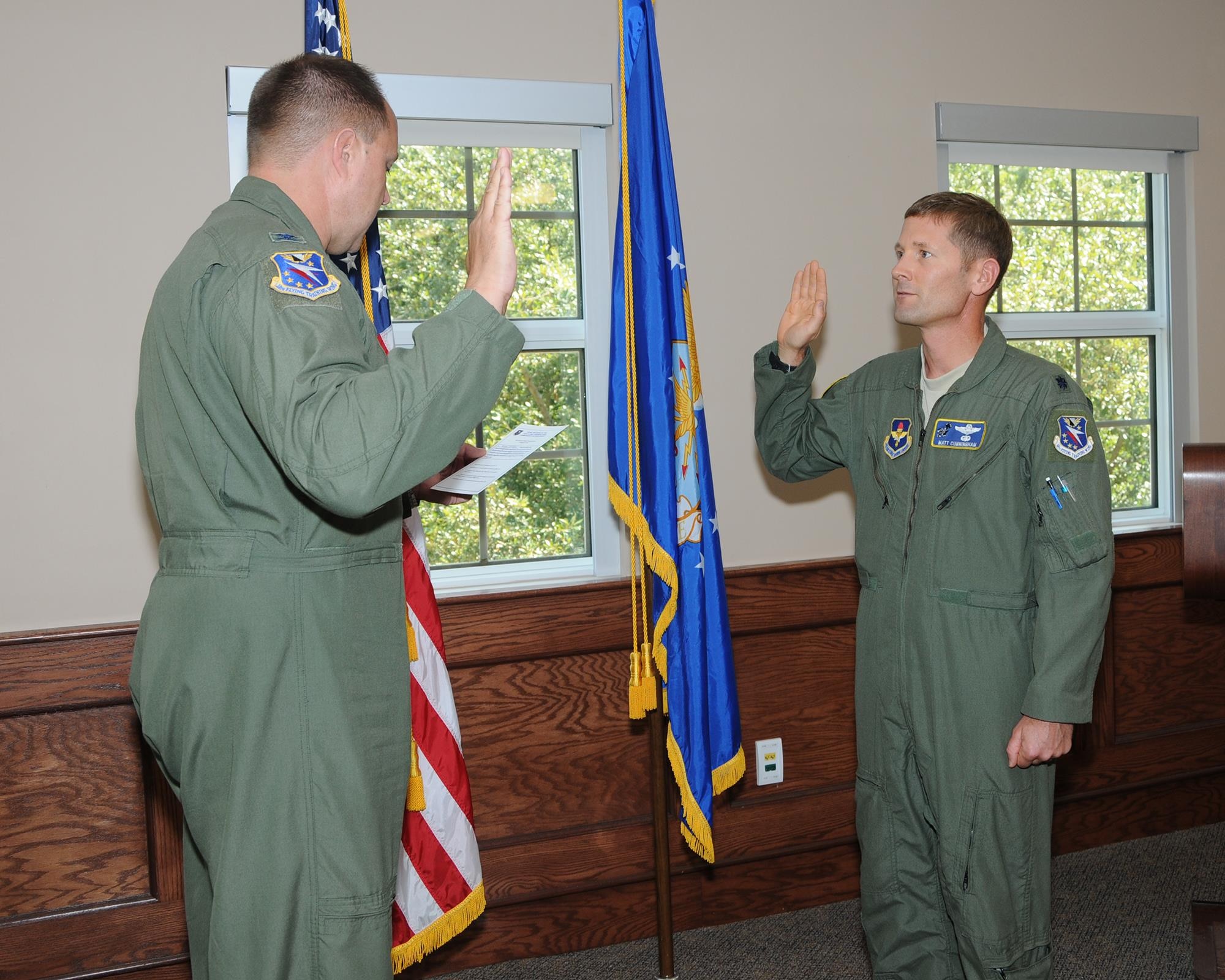 Col. John Nichols, 14th Flying Training Wing Commander, delivers the IG oath to Lt. Col Matt Cunningham, 14th Flying Training Wing Director of Complaint Resolution, Aug. 5 on Columbus Air Force Base, Mississippi. IGs are administered this oath in addition to any oath prior to joining the military to ensure they are bound to finding the whole and unbiased truth. (U.S. Air Force photo/Melissa Doublin)