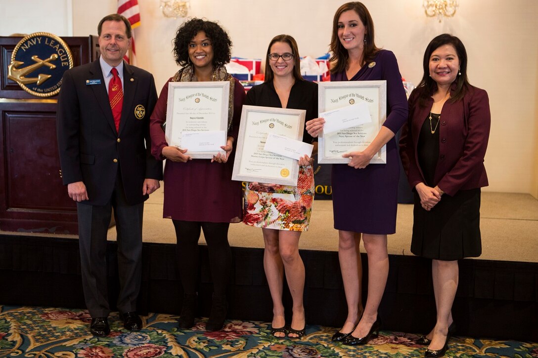 The 2015 San Diego Sea Service Coast Guard, Marine Corps and Navy Spouses of the Year recipients Cutter Boutwell, Amanda McMillan and Candace McVey pose with the council president and vice president of the San Diego Council Navy League of the United States after being awarded at the SDCNL monthly luncheon in San Diego, Dec. 4.  Nominees were selected by their respective commands for exhibiting a balance in their military community, their work and home life, and for serving their local community.