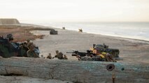 A rifleman holds security outside a simulated combat town after conducting a beach landing during Exercise Steel Knight aboard Marine Corps Base Camp Pendleton, Calif., Dec. 4, 2015. The U.S. Navy and Marine Corps continue to combine efforts to revitalize, refine and strengthen fundamental amphibious capabilities, and reinforce the Navy and Marine Corps team. Steel Knight will test the Marine Air Ground-Task Force’s expeditionary capabilities through realistic, scenario-driven training. 