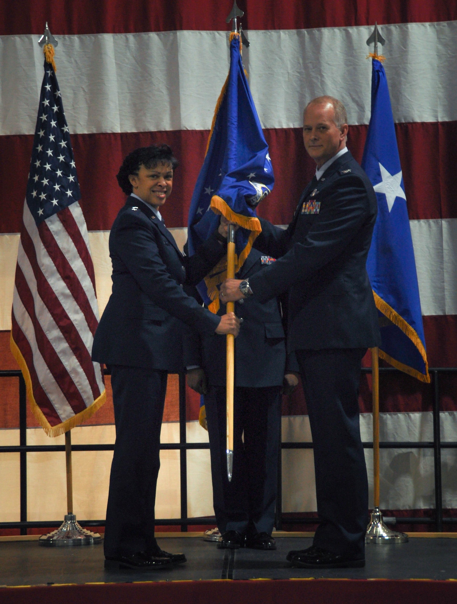 Maj. Gen. Stayce D. Harris, 22nd Air Force commander, conferred command of the 94th Airlift to to Col. Steven B. Parker during an assumption of command ceremony at Dobbins Air Reserve Base, Ga., Dec. 6, 2015. Parker assumed leadership of the wing following a four-month period of command for Col. Brent A. Merritt, 94 AW vice commander. (U.S. Air Force photo/Senior Airman Miles Wilson)
