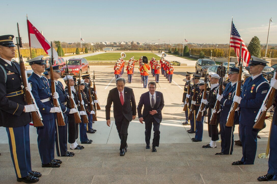 U.S. Defense Secretary Ash Carter welcomes Singaporean Defense Minister Ng Eng Hen to the Pentagon, Dec. 7, 2015. The two leaders met to discuss matters of mutual importance. DoD photo by Air Force Senior Master Sgt. Adrian Cadiz