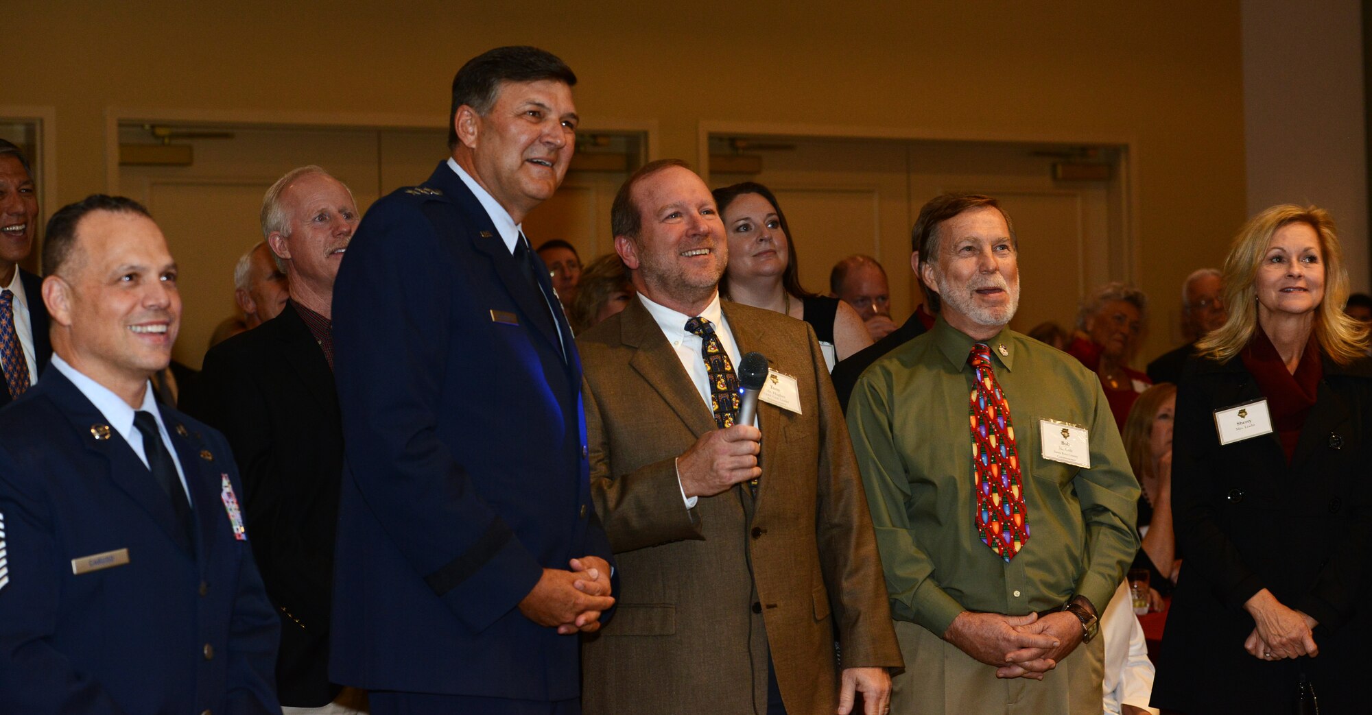 Lt. Gen. Brad Heithold, commander of Air Force Special Operations Command, and Tony Hughes, Beach Community Bank CEO and president, talk to deployed Air Commandos though a video conference at the Soundside Club Dec. 4, 2015. Civic leaders took this opportunity to thank Air Commandos for their service downrange. (U.S. Air Force photo/Staff Sgt. Melanie Holochwost) 