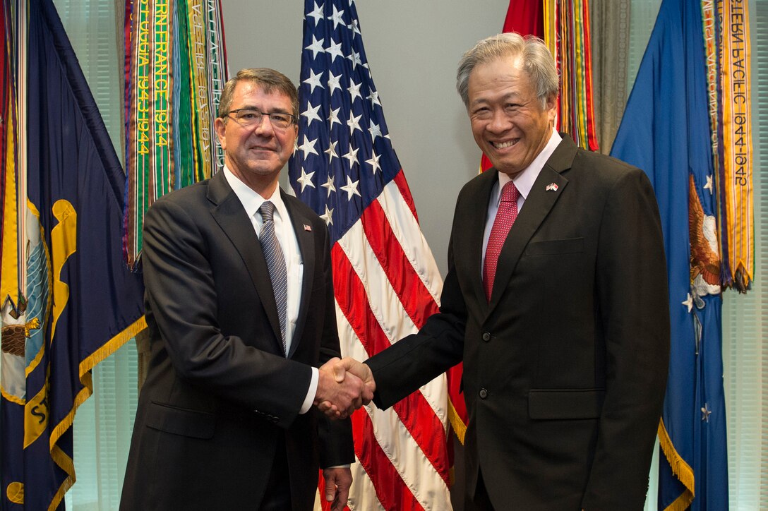 U.S. Defense Secretary Ash Carter poses for a photo with Singaporean Defense Minister Ng Eng Hen at the Pentagon, Dec. 7, 2015. The two leaders met to discuss matters of mutual importance. DoD photo by Air Force Senior Master Sgt. Adrian Cadiz