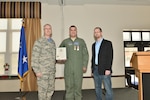 After receiving the Air Force Commendation Medal and the New York State Medal for Meritorious Service Dec. 6, 2015, Col. Robert Kilgore, commander, 107th Airlift Wing, poses with Tech. Sgt. Jason Oehlbeck who saved the life of Jack Ewald.