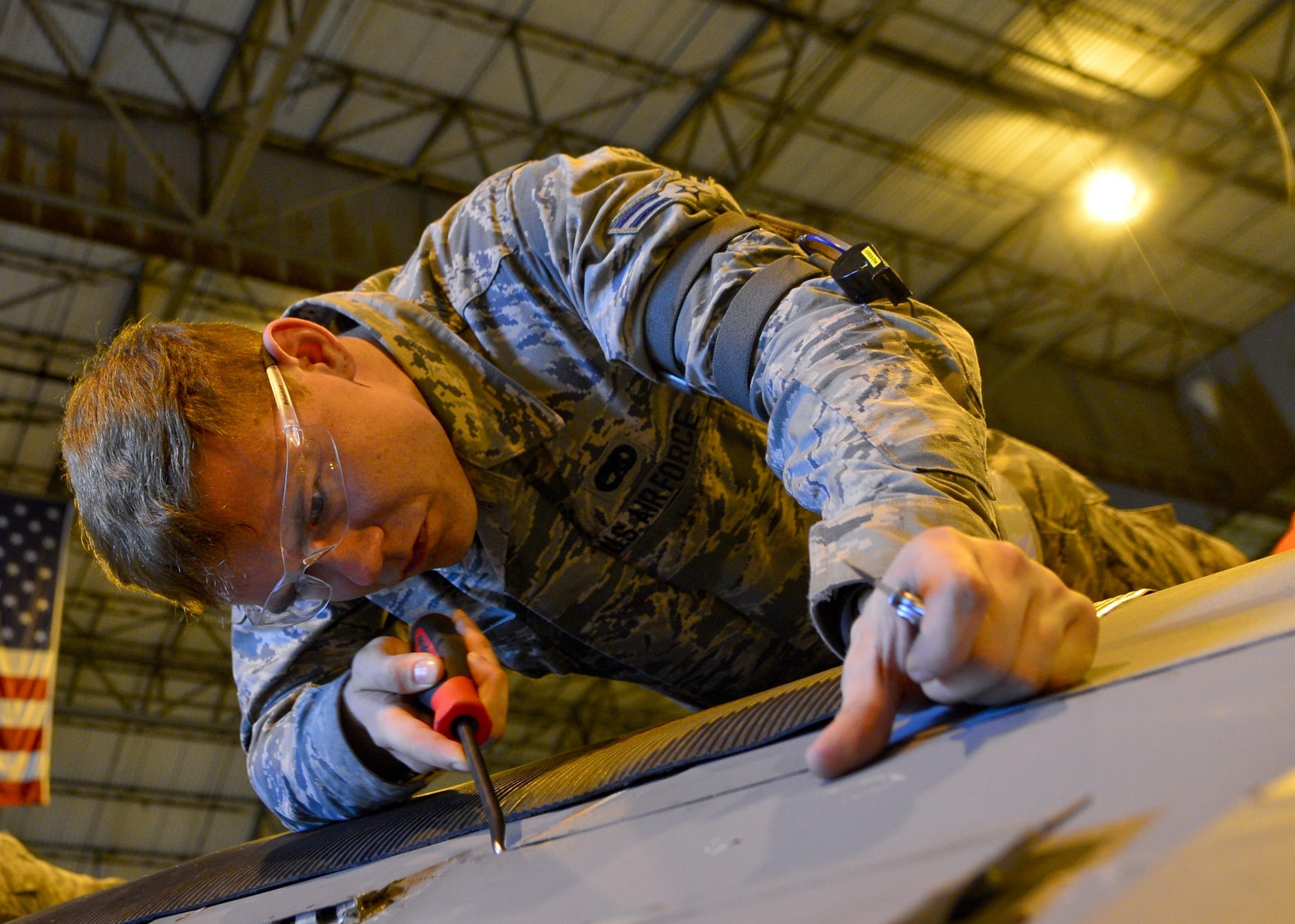 Airman 1st Class Jesse Gordon, a 436th Maintenance Squadron crew chief, removes coder pins from an aero seal on a C-5M Super Galaxy during a Maintenance Steering Group-3 Major inspection Dec. 2, 2015, in the isochronal dock at Dover Air Force Base, Del. The ISO dock at Dover AFB is the only maintenance dock in the Air Force capable of performing MSG-3 inspections of C-5 aircraft. (U.S. Air Force photo/Senior Airman William Johnson)