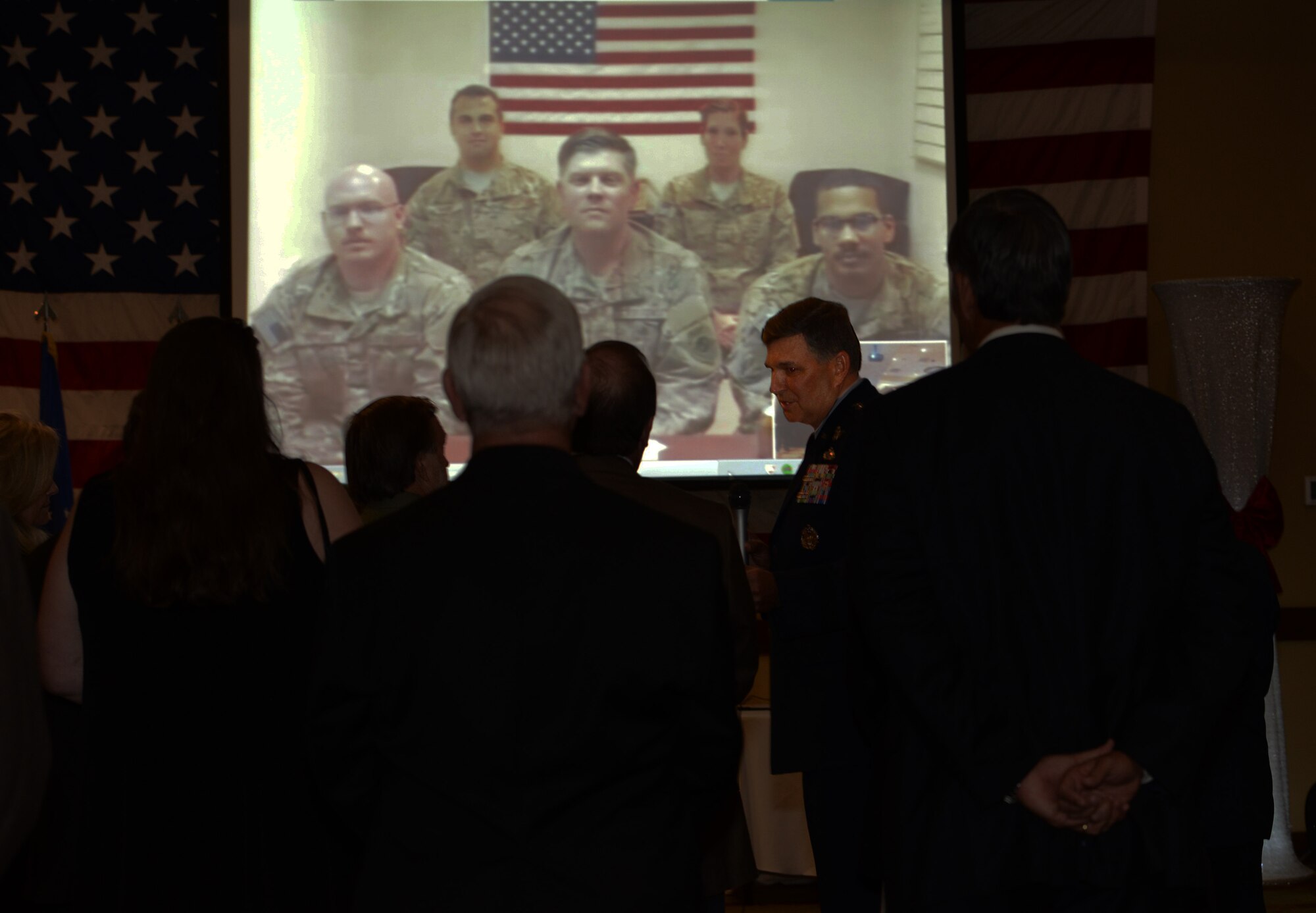 Lt. Gen. Brad Heithold, commander of Air Force Special Operations Command, and several community leaders talk to Air Commandos downrange though a video conference at the Soundside Club Dec. 4, 2015. About 20 civic leaders attended the event. (U.S. Air Force photo/Staff Sgt. Melanie Holochwost) 