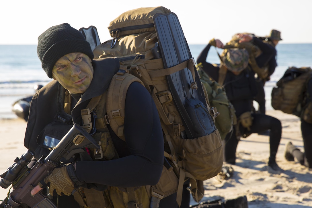 A Marine with 2nd Reconnaissance Battalion, 2nd Marine Division, II Marine Expeditionary Force prepares to move inland during a reconnaissance mission at Onslow Beach, N.C., the morning of Nov. 4, 2014. The reconnaissance Marines secured a beachhead for the assault amphibious vehicles of 2nd Assault Amphibian Battalion, 2nd Marine Division, which landed shortly after. The training exercise was one of many ongoing operations taking part during Bold Alligator 14, a scenario-driven event designed to test the Navy-Marine Corps team’s ability to conduct multifaceted operations from a base of support at sea. Reconnaissance Marines on the beach tested their ability to send back vital information to commanders off the coast, painting a picture of the landing zone and any enemy activity inland. Working off of their real-time intelligence, commanders then organized a larger beach landing to simulate the type of operation that could be used to support a Marine Air Ground Task Force’s operations ashore with follow-on logistical and reinforcing units in a forward-deployed environment.