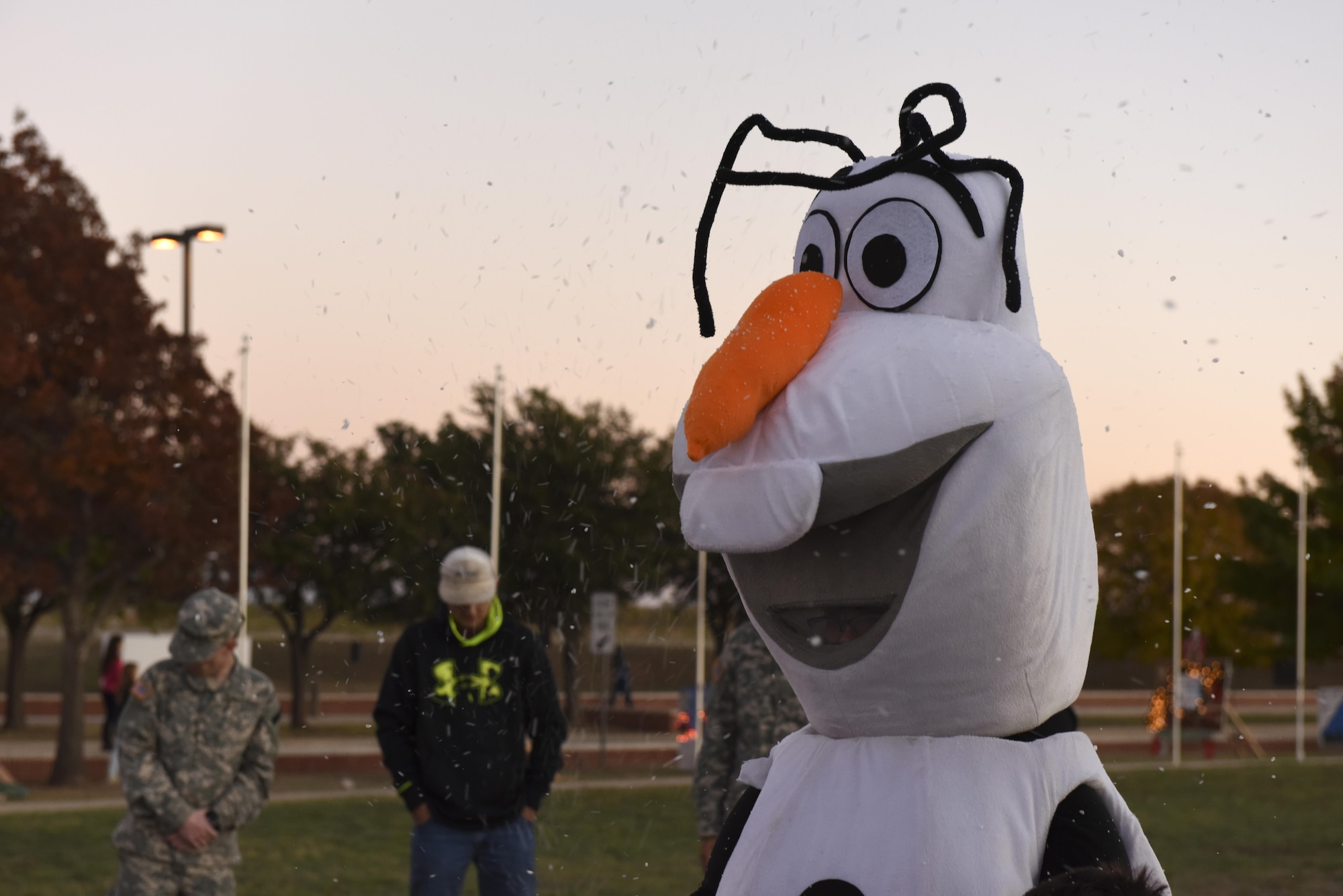 A Tree Lighting ceremony participant dressed as a character from a movie greets kids at the Parade Field on Goodfellow Air Force Base, Texas, Dec. 3, 2015. The event also had games and a snow machine for children. (U.S. Air Force photo by Airman Chase Sousa/Released)