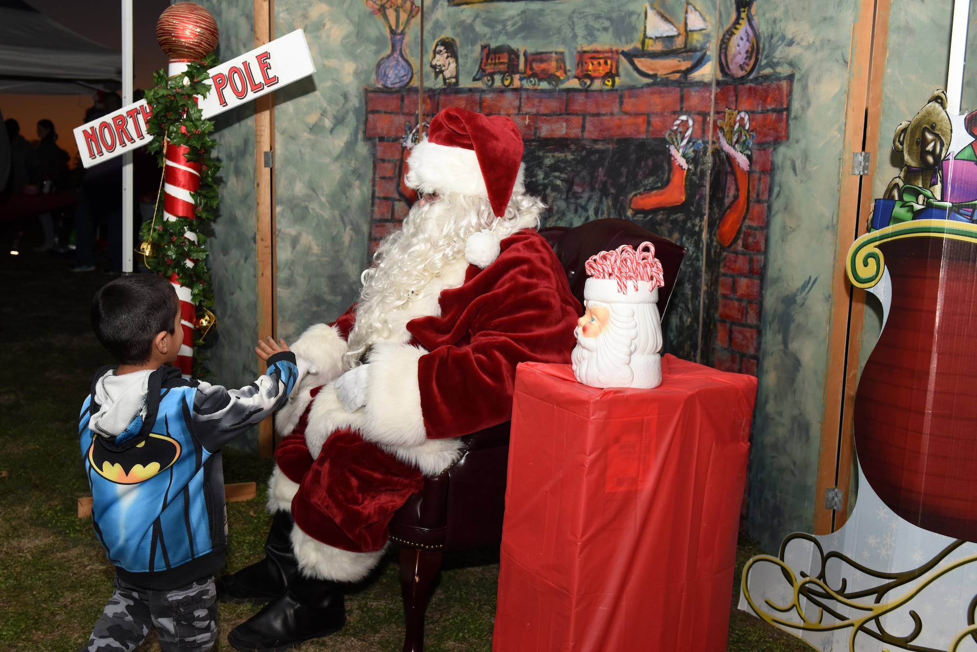 A child prepares to sit on Santa’s lap at the Tree Lighting ceremony at the Parade Field on Goodfellow Air Force Base, Texas, Dec. 3, 2015. The base invited all families to the ceremony to celebrate. (U.S. Air Force photo by Airman Chase Sousa/Released)