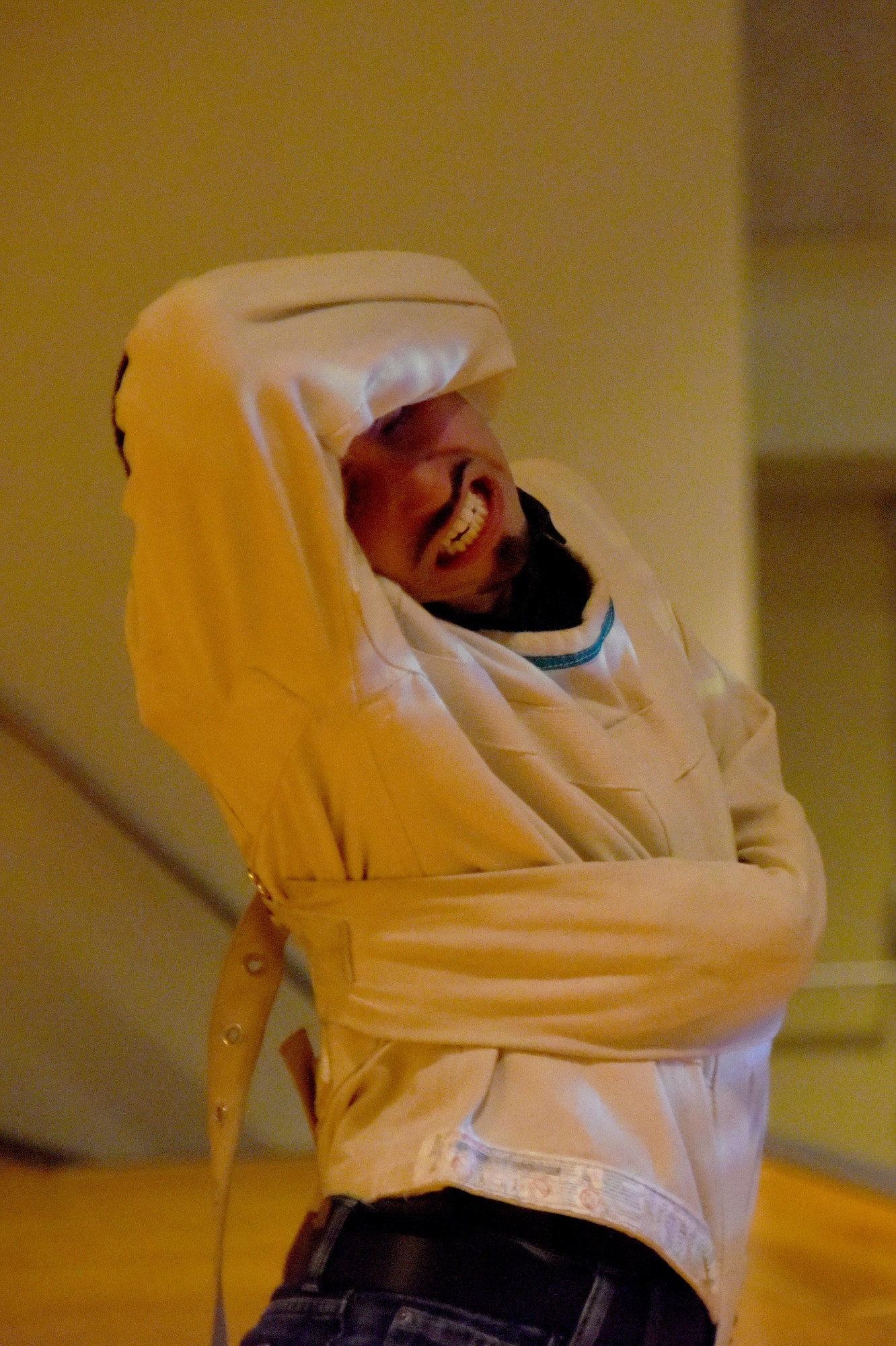 Matt the Knife, magician and mentalist, escapes a straitjacket during his performance at the theater on Goodfellow Air Force Base, Texas, Dec. 4, 2015. Matt has performed at more than 100 different bases to give back to military personnel. (U.S. Air Force photo by Senior Airman Joshua Edwards/Released)