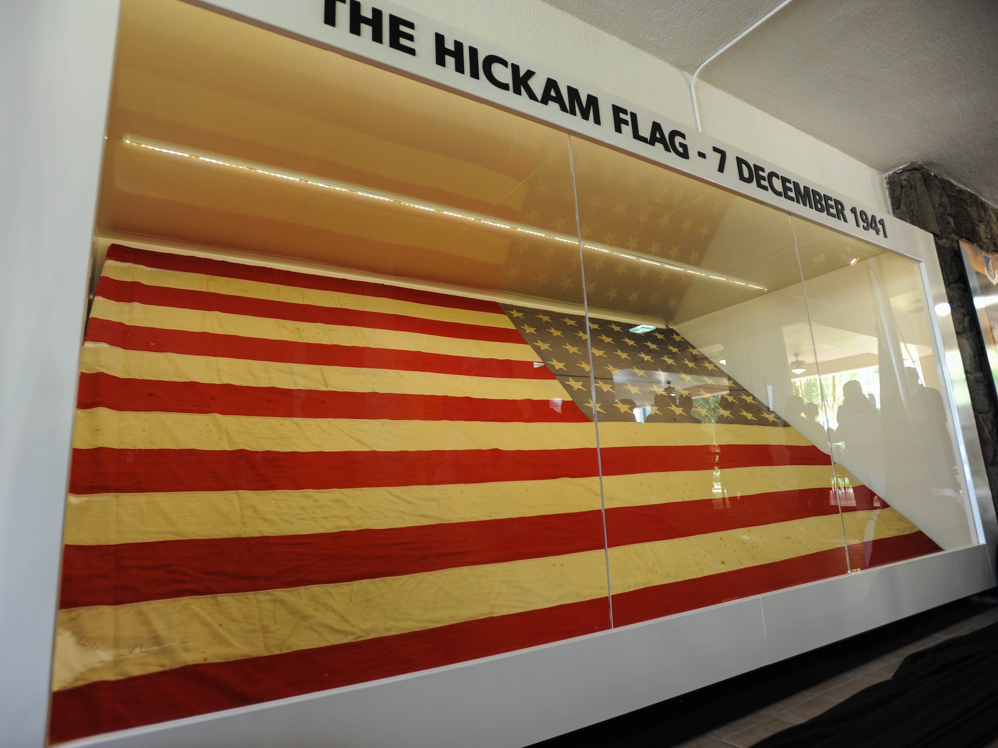 "Old Glory" is diplayed in its new display case, Dec. 7, 2015, Joint Base Pearl Harbor-Hickam, Hawaii. A ceremony was held for the unveiling of the new case, which was updated to better preserve the flag. (U.S. Air Force photo by Tech. Sgt. Amanda Dick/Released)