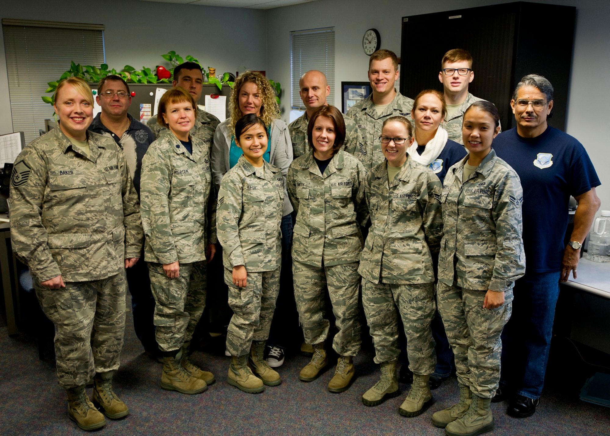 Members of the 446th Comptroller Office and the 62nd Comptroller Squadron pose for a photo Nov. 7, 2015 at the 446th Airlift Wing Headquarters building. These Airmen team up on UTA weekends to help Reservists with travel vouchers. The 62nd Airlift Wing Airmen are able to provide support for eFinance, while the 446th Reservists and civilians are able to guide travelers through the Defense Travel System vouchers.