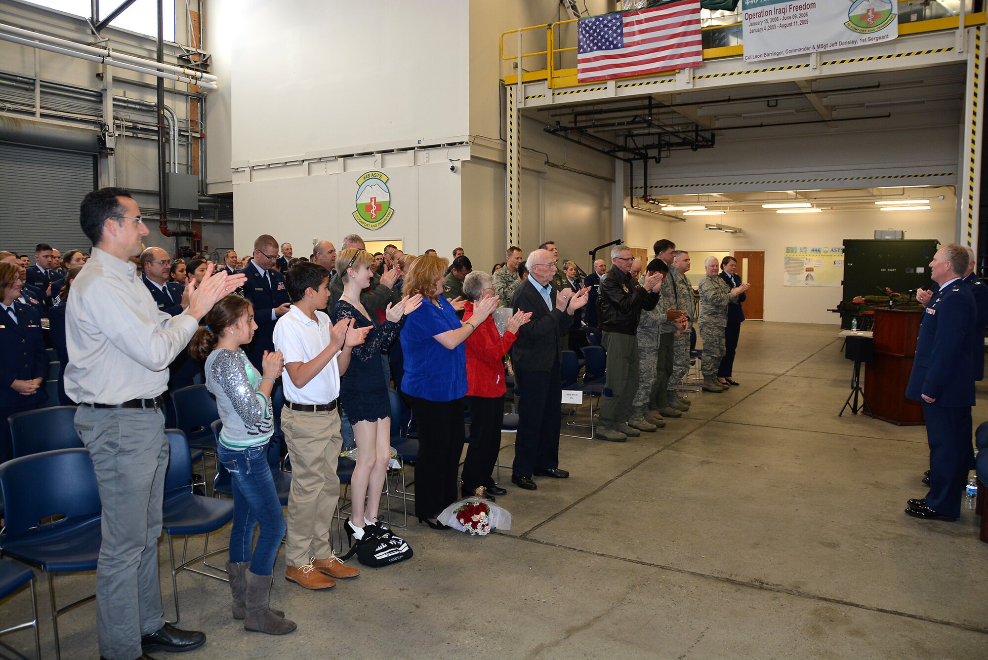 Col. (Dr.) Bruce Neely, 446th Aerospace Staging Squadron commander, receives applause after accepting his role as the new commander of the 446th ASTS. During his speech, he let the squadron know what to expect from him and what he expected of them. Some of these expectations included taking care of each other, learning something new every day, and expressing frustrations with solutions to him.