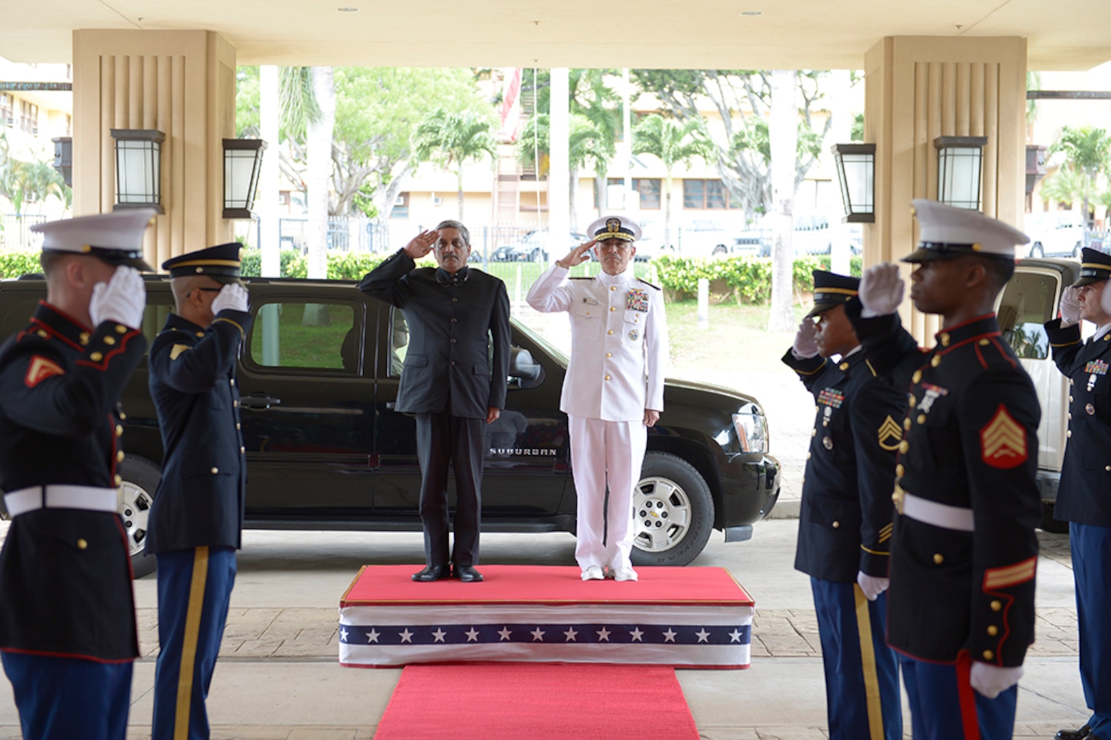 CAMP H.M. SMITH, Hawaii (Dec. 7, 2015) Commander of U.S. Pacific Command (PACOM), Adm. Harry B. Harris Jr., right, and India Defence Minister, Manohar Parrikar, render honors during a welcome ceremony. During this first-ever visit by an India Defense Minister to the PACOM headquarters, Parrikar met with Harris to discuss partnerships and the maritime security cooperation in the Indo-Asia-Pacific. 
