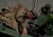 Army Staff Sgt. Tom Mcewan and Army Spc. Amanda Ballentine, 301st Maneuver Enhancement Brigade, work atop a M1136 Stryker combat vehicle to prepare it for measurements and weighing at Joint Base Lewis-McChord, Dec. 6. The 36th Aerial Port Squadron out of McChord Field helped to train the Army’s 301st Maneuver Enhancement Brigade on preparing a Stryker for transport in a C-17 Globemaster III.