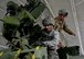 Army Staff Sgt. Tom Mcewan and Army Spc. Amanda Ballentine, 301st Maneuver Enhancement Brigade, work atop a M1136 Stryker combat vehicle to prepare it for measurements and weighing at Joint Base Lewis-McChord, Dec. 6, 2015. The 36th Aerial Port Squadron out of McChord Field helped to train the U.S. Army’s 301st Maneuver Enhancement Brigade on preparing a Stryker for transport in a C-17 Globemaster III.