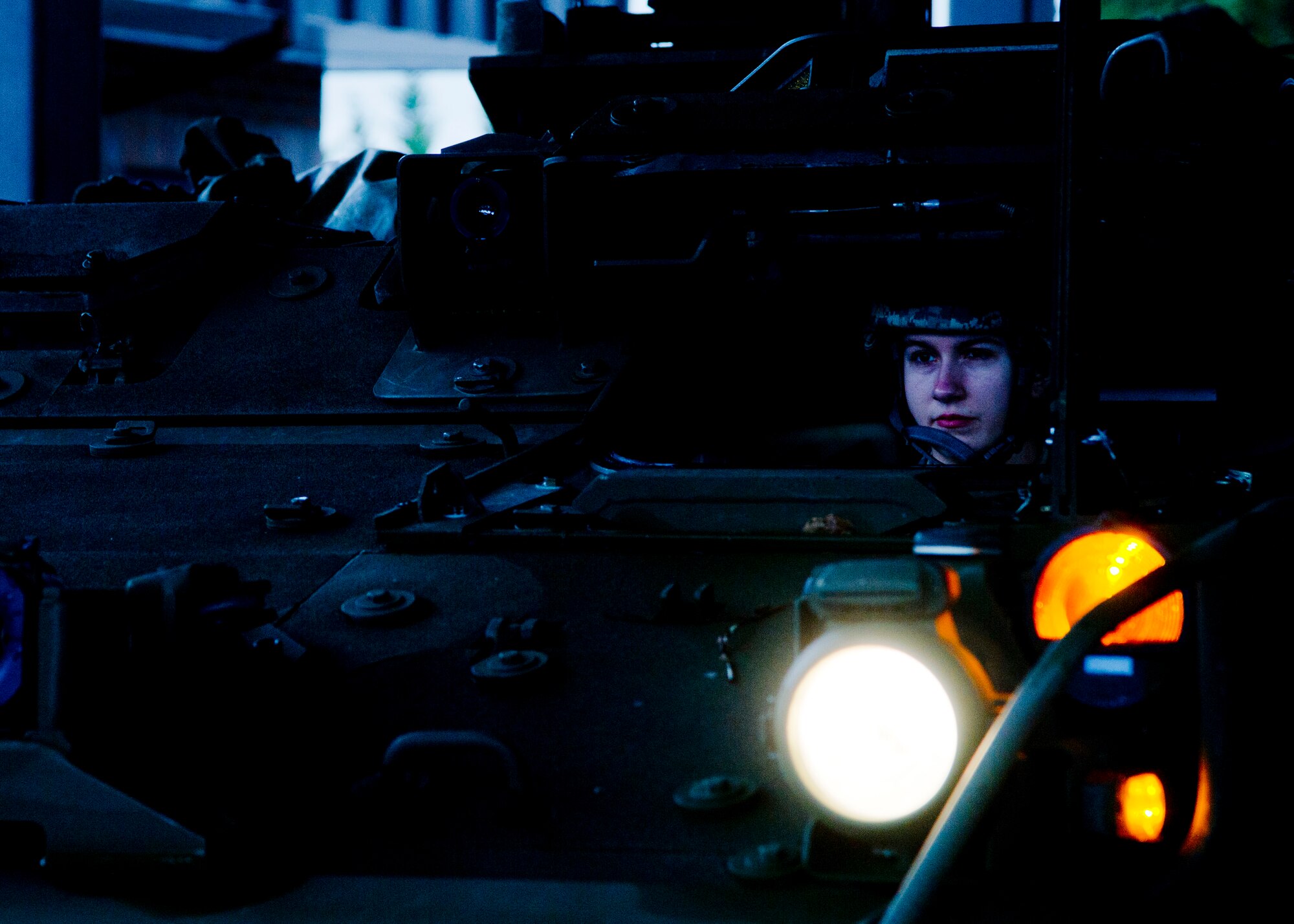 Army Spc. Amanda Ballentine, 301st Maneuver Enhancement Brigade, reverses a M1136 Stryker combat vehicle for measurements and weighing at Joint Base Lewis-McChord, Dec. 6. The 36th APS out of McChord Field helped to train the U.S. Army’s 301st Maneuver Enhancement Brigade on preparing a Stryker for transport in a McChord C-17 Globemaster III.