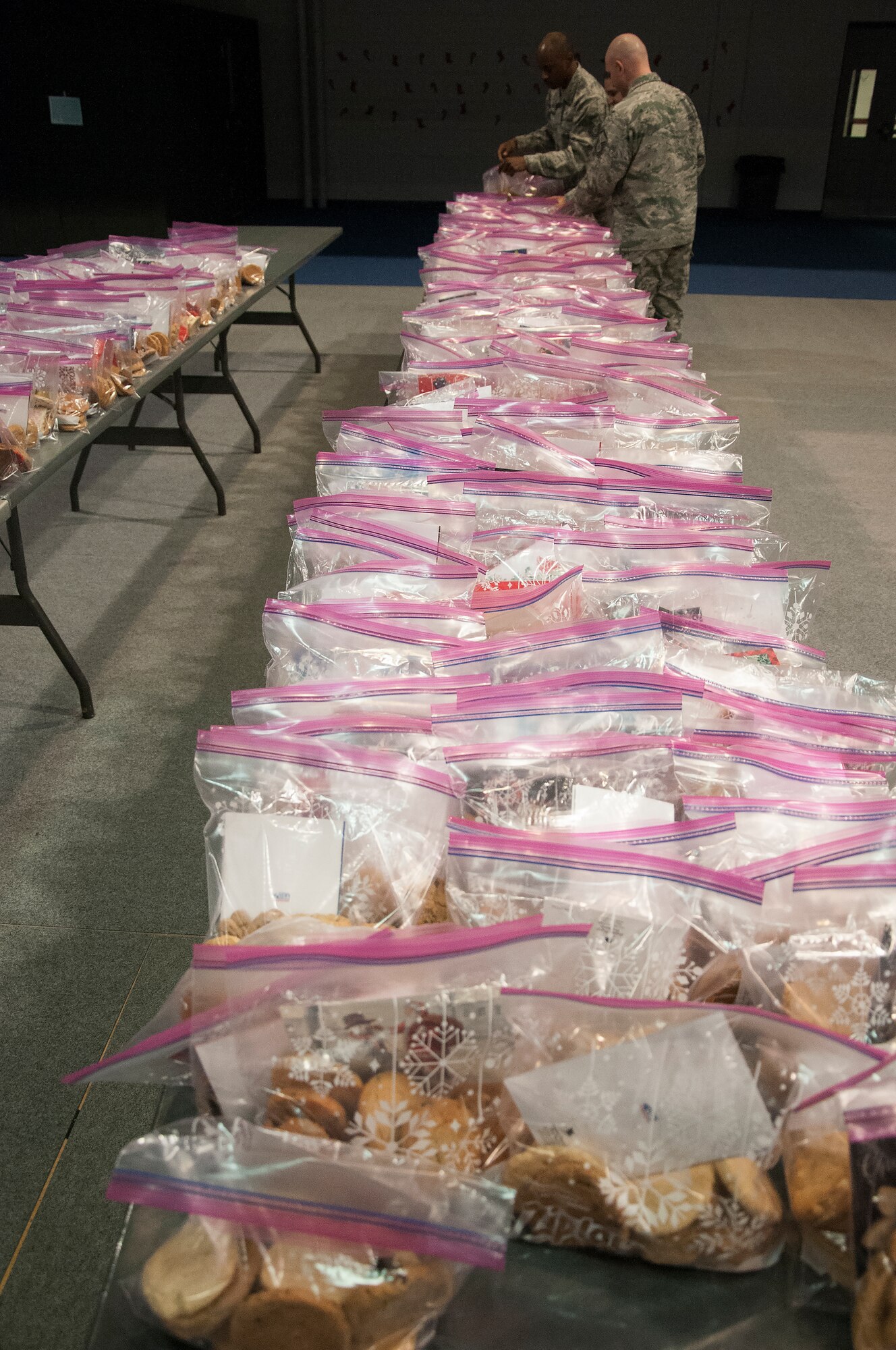 Bags full of cookies await distribution to Airmen Dec. 7, 2015, inside the Fall Hall Community Center on F.E. Warren Air Force Base, Wyo. About 500 bags of cookies were delivered to Airmen living in the dorms to help celebrate the holiday season. (U.S. Air Force photo by Senior Airman Brandon Valle) 