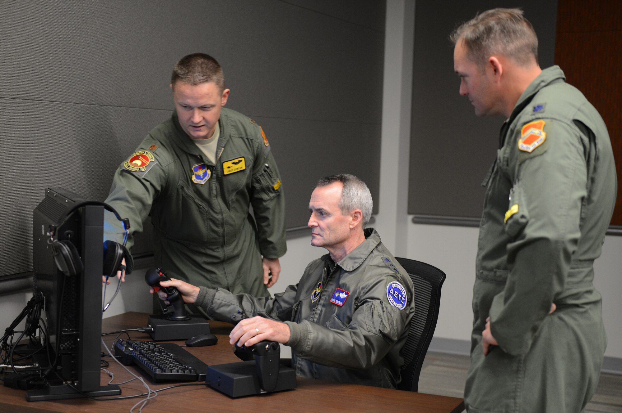 Lt. Gen. Darryl Roberson, commander of Air and Education Training Command, flies an F-35 Lightning II computer simulator at Luke Air Force Base, Ariz., Dec. 3, 2015. Roberson visited the 56th Fighter Wing to see the progress being made to transition from F-16 training to F-35 training. (U.S. Air Force photo by Senior Airman James Hensley)