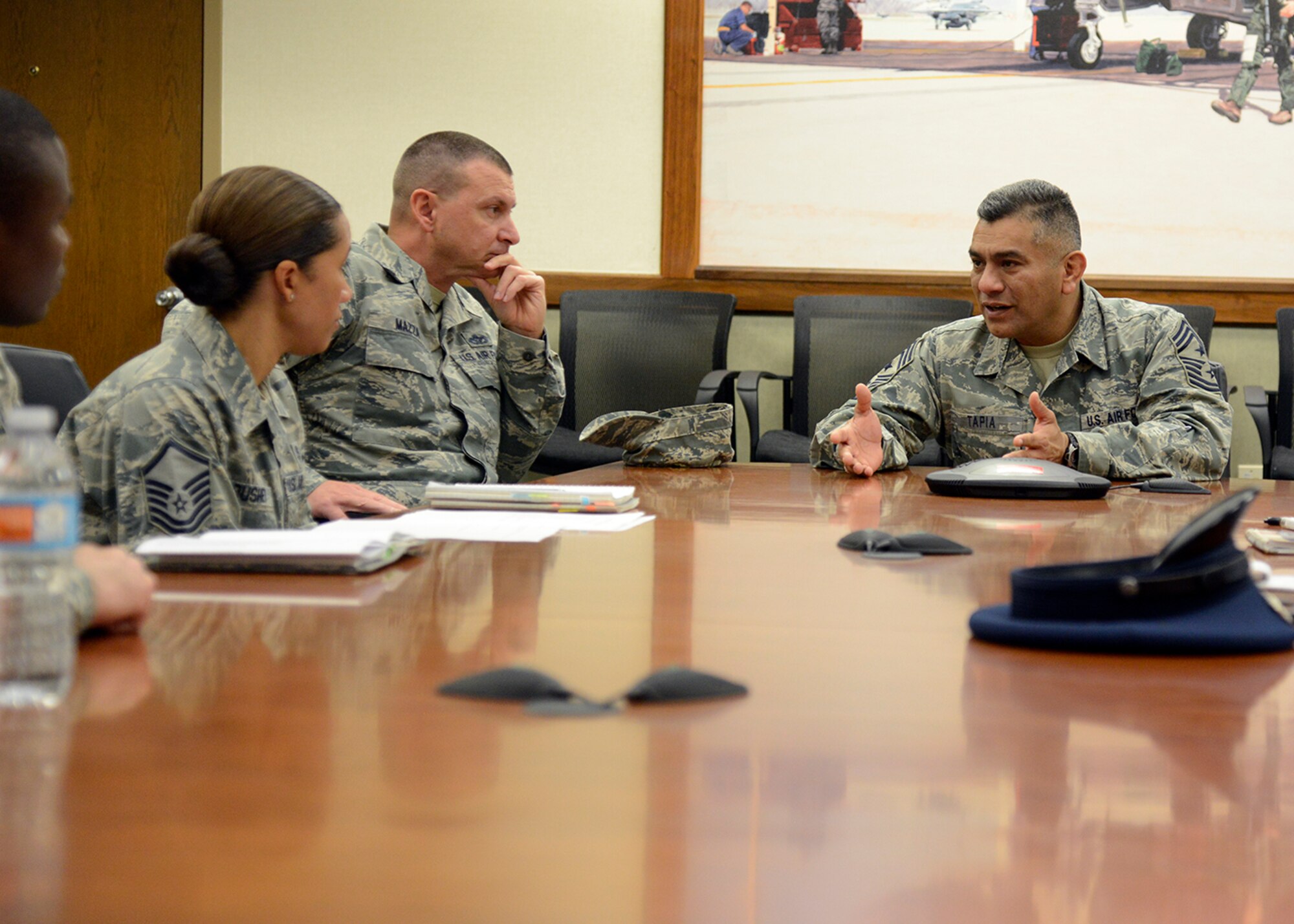 Command Chief Master Sgt. Gerardo Tapia, Air Education and Training Command, speaks to the Lightning Leadership members in the 56th Fighter Wing Headquarters building at Luke Air Force Base, Ariz., Dec. 3, 2015. Tapia spoke with the Airmen about the Lightning Leadership Gold courses and how they can make the course more open to Luke Airmen. (U.S. Air Force photo by Senior Airman Devante Williams)