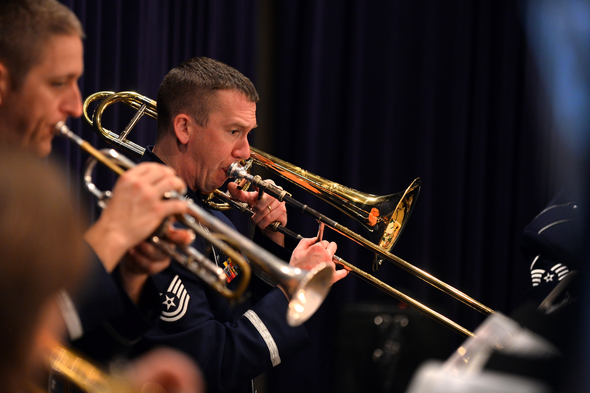 U.S. Air Force Tech. Sgt. Benjamin Kadow, with the U.S. Air Force Heartland of America Band, performs with the Offutt Brass ensemble at the Christmas Tree Lighting ceremony held at the Patriot Club on Dec. 3, Offutt Air Force Base, Neb.  The tree lighting event kicks off the holiday season with hundreds of families pouring into the club every year to the increasingly popular event.  (U.S. Air Force photo by Josh Plueger/Released)