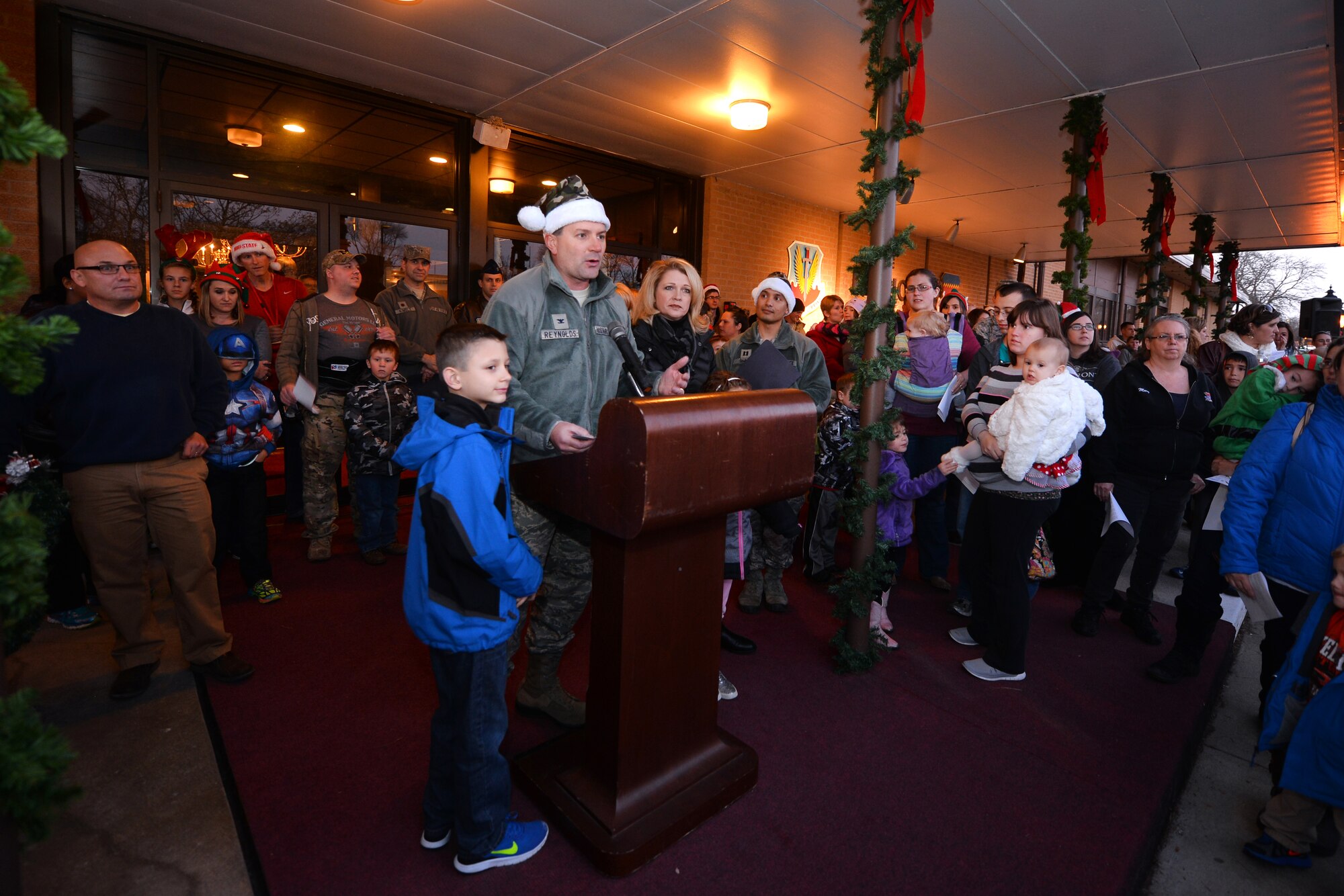 U.S. Air Force Col. Marty Reynolds, 55th Wing commander, provides opening remarks to people gathered to celebrate the annual Christmas Tree Lighting ceremony hosted at the Patriot Club on Dec. 3, Offutt Air Force Base, Neb.  Hundreds of people gathered for the event made possible by the 55th Force Support Squadron.  (U.S. Air Force photo by Josh Plueger/Released)