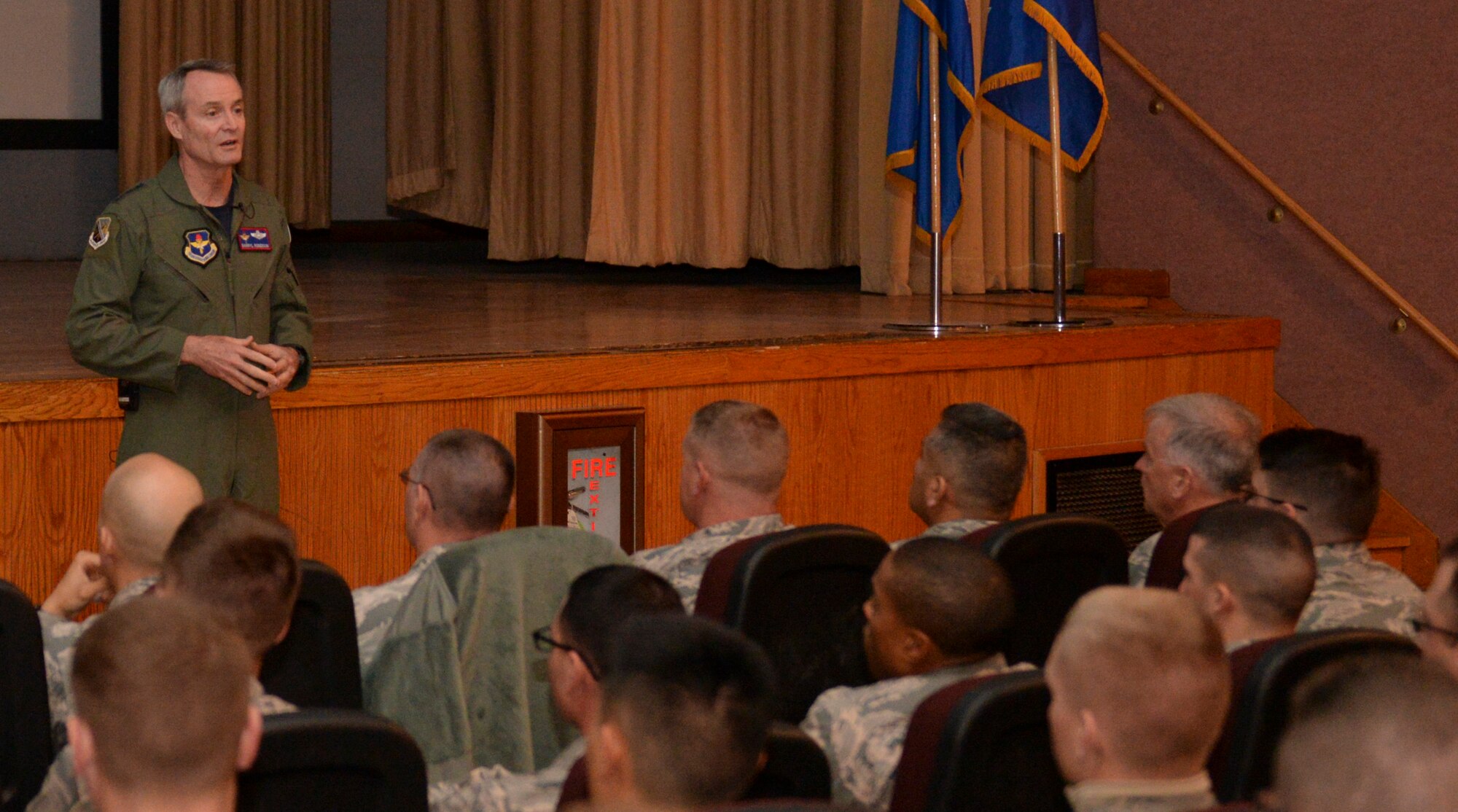 The commander of Air and Education Training Command, Lt. Gen. Darryl Roberson, holds an All Call at the base theater at Holloman Air Force Base, New Mexico on Dec. 4. Roberson spoke about opening up more special duty positions to fill the need for an estimated 7,000 Air Force personnel expected to join by the end of fiscal year 2016. During his visit to Holloman, Roberson also met and coined five superior performers from the 54th Fighter Group. (U.S. Air Force photo by Staff Sgt. E’Lysia A. Wray)
