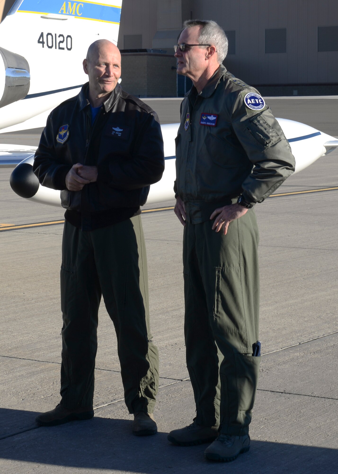 Colonel Jeffrey Jenssen, the 54th Fighter Group commander, greets the commander of Air and Education Training Command, Lt. Gen. Darryl Roberson, on the flightline at Holloman Air Force Base, New Mexico on Dec. 4. Roberson was appointed as the new AETC commander in July 2015. During his visit to Holloman, Roberson held an All Call at the base theater where he talked about the upcoming changes to AETC and how they will affect its members. (U.S. Air Force photo by Staff Sgt. E’Lysia A. Wray)