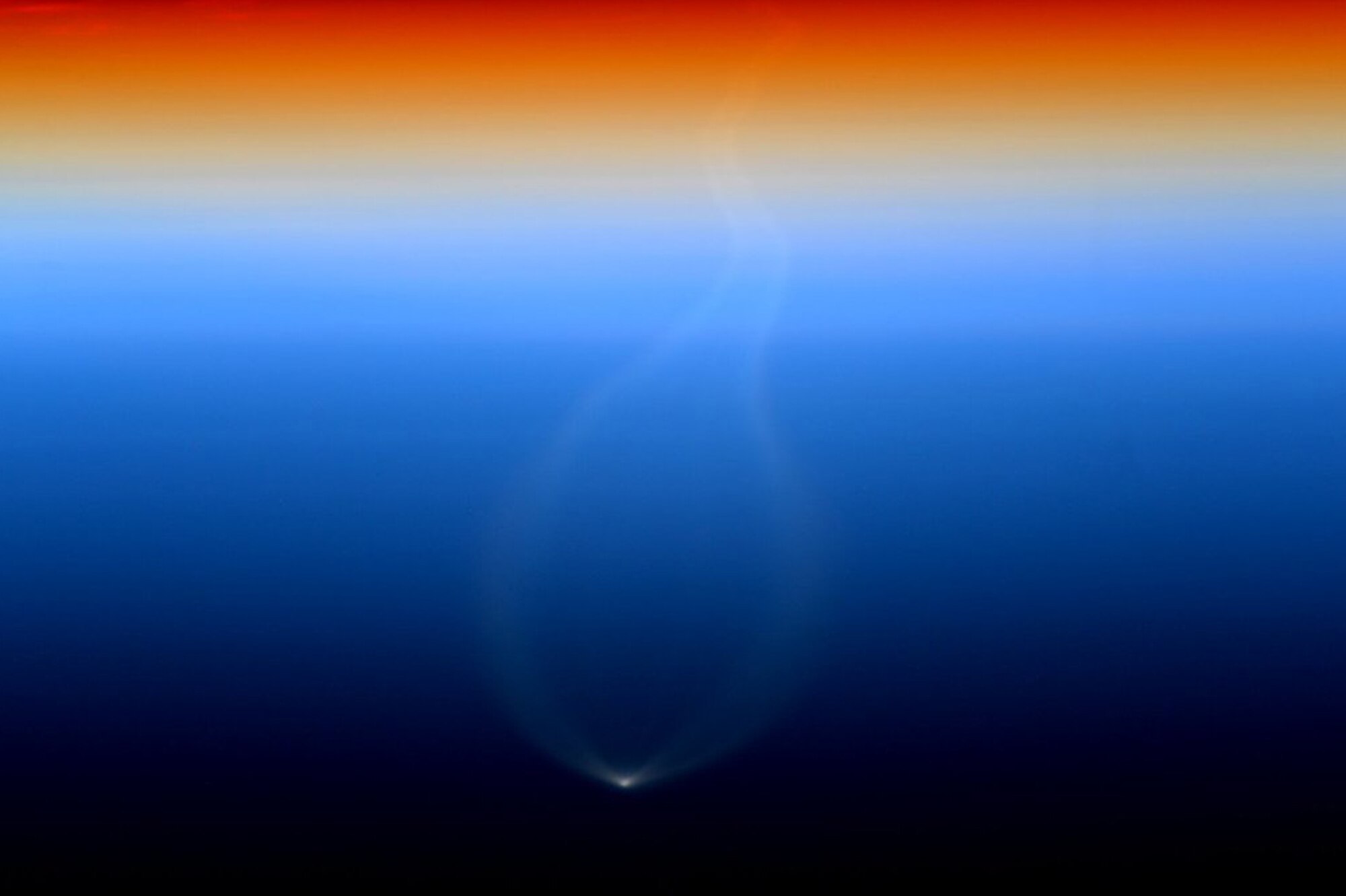 The Cygnus resupply spacecraft rises above the horizon shortly after being launched aboard a United Launch Alliance Atlas V rocket Dec. 6 at 4:44 p.m. from Cape Canaveral Air Force Station, Fla. The photo was taken by NASA Commander Scott Kelly from the International Space Station. The Cygnus craft is due to arrive at the ISS Dec. 9 with nearly 8,000 pounds of supplies. Reservists from the 920th Rescue Wing provide range clearance and safety support for all launches from CCAFS. (NASA courtesy photo/Scott Kelly)