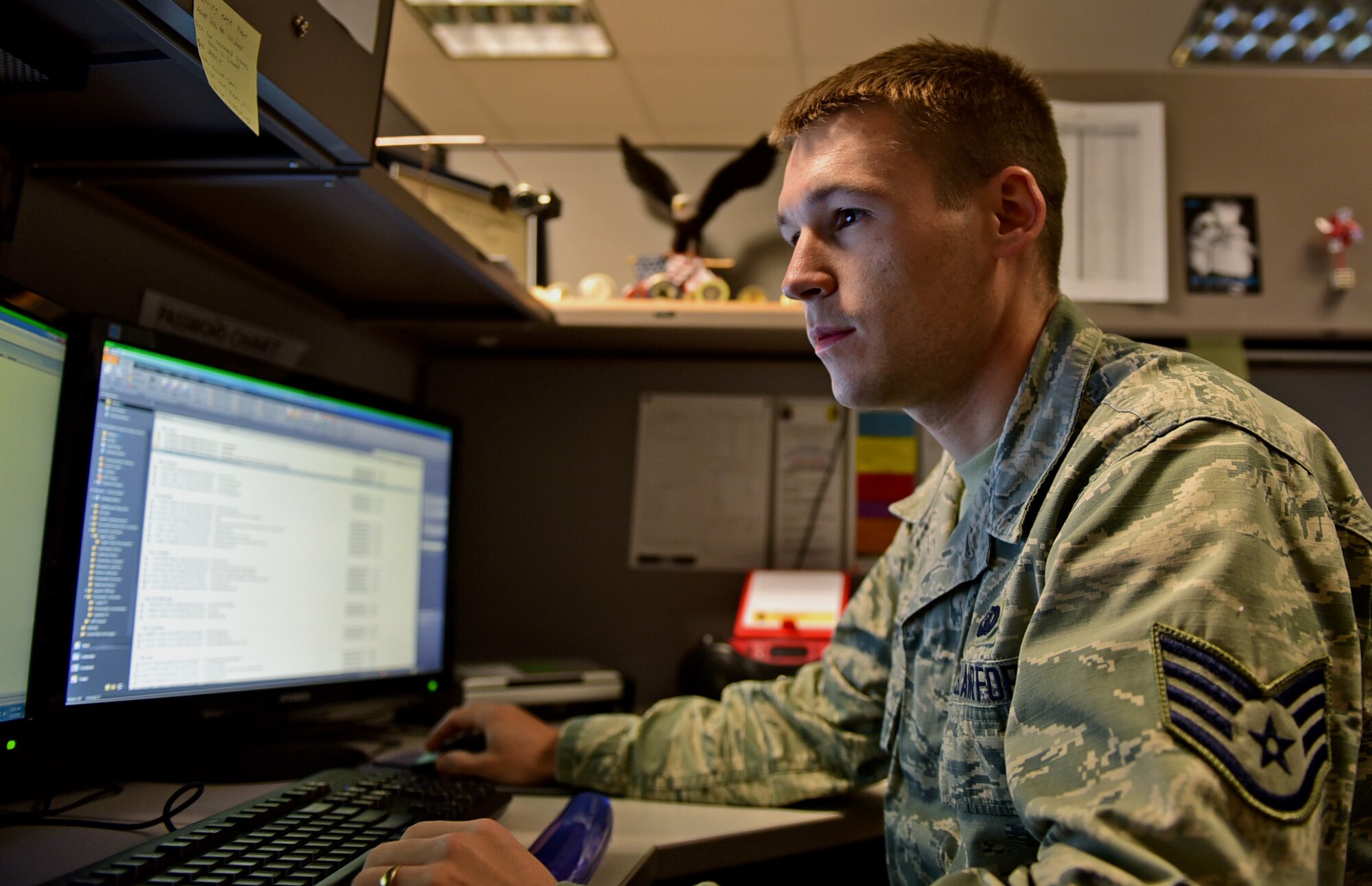 Staff Sgt. Chris Meyer, 28th Contracting Squadron contract administrator, reviews paperwork at the 28th CONS office at Ellsworth Air Force Base, S.D., Nov. 4, 2015. One of Meyer’s primary duties is reviewing contracts to ensure adherence to Air Force guidelines prior to their approval. (U.S. Air Force photo by Airman 1st Class James L. Miller/Released)