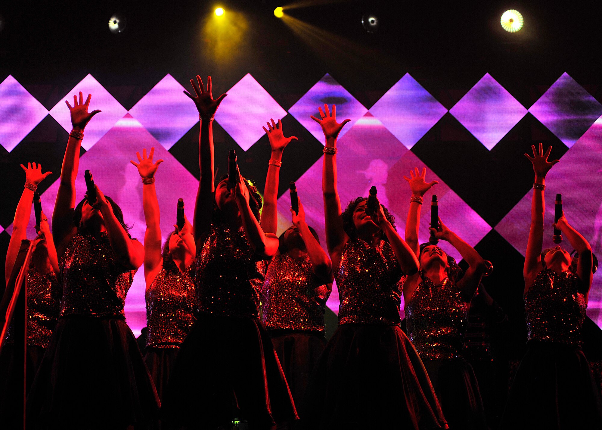 Female performers from Tops in Blue sing and dance at the Chester Fritz Auditorium on the University of North Dakota campus, Dec. 2, 2015, in Grand Forks, North Dakota. Tops in Blue will perform 73 shows in multiple countries around the world. (U.S. Air Force photo by Senior Airman Xavier Navarro/Released)
