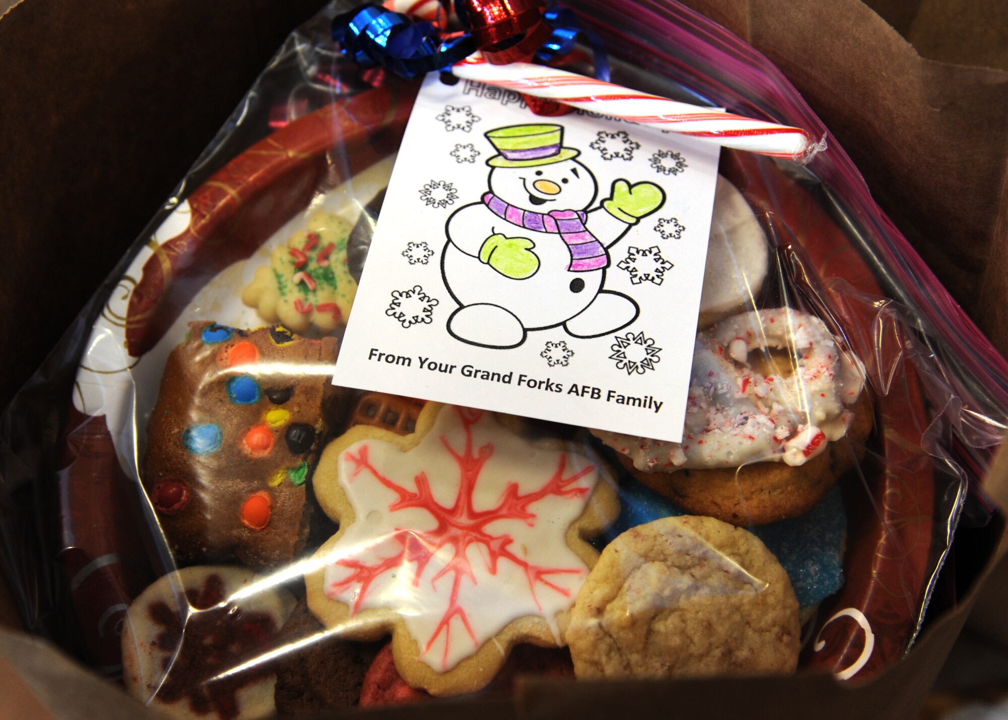 Cookies are ready to be delivered to dormitory dwelling Airmen Dec. 7, 2015, on Grand Forks Air Force Base, North Dakota. The Grand Forks AFB Spouses? Club collected and packaged cookies and the first sergeants delivered them to the dorms. (U.S. Air Force photo by Airman 1st Class Ryan Sparks/Released)