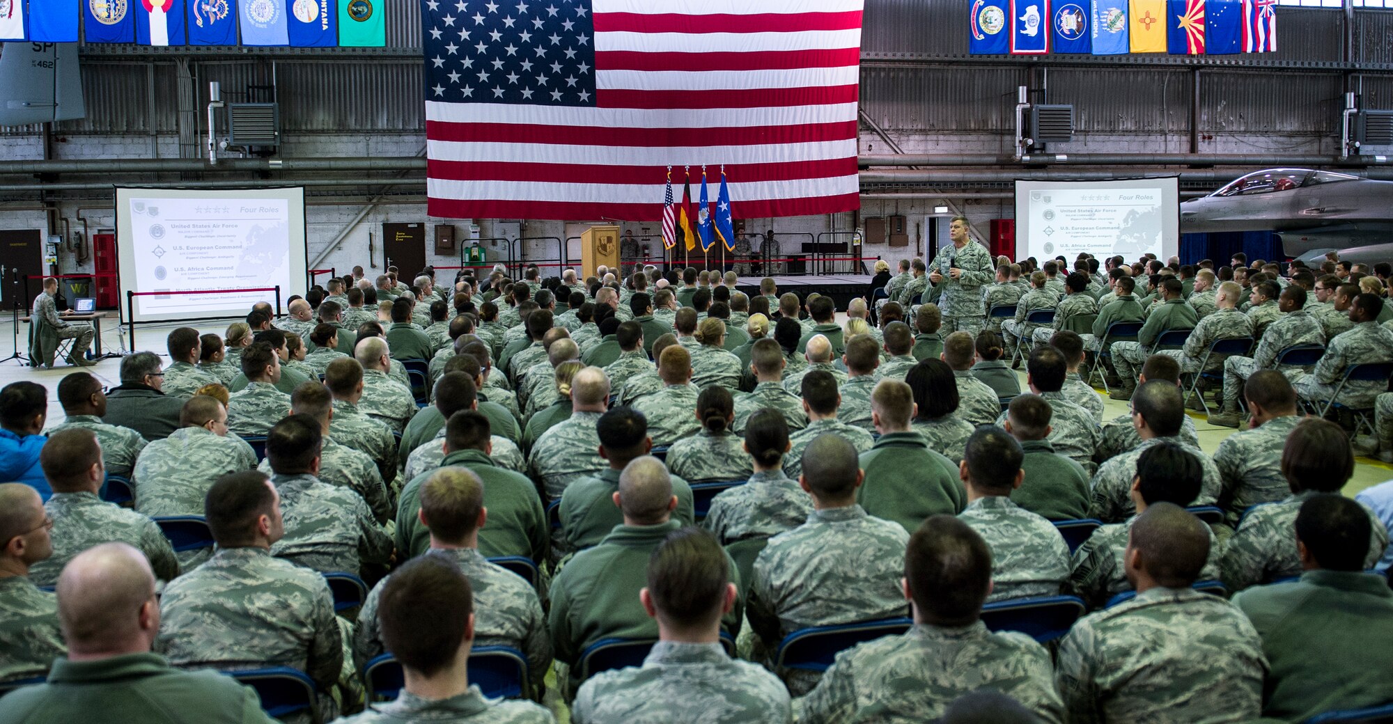 Spangdahlem Airmen listen to U.S. Air Force Gen. Frank Gorenc, U.S. Air Forces in Europe and Air Forces Africa commander, during an all call inside Hangar 1 at Spangdahlem Air Base, Germany, Dec. 3, 2015. Hundreds of  Airmen attended the event and listened to the general address current Air Force issues. (U.S.  Air Force photo by Senior Airman Rusty Frank/Released)