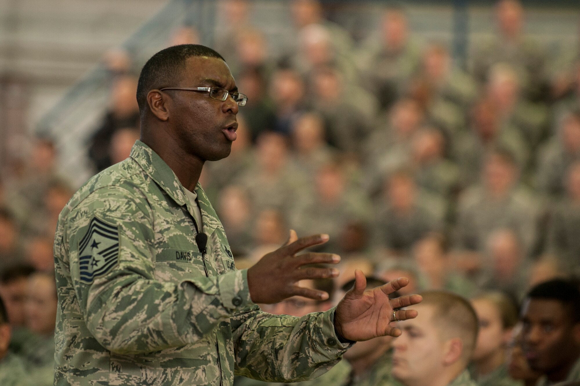 U.S. Air Force Chief Master Sgt. James Davis, U.S. Air Forces in Europe and Air Forces Africa command chief, speaks during an all call inside Hangar 1 at Spangdahlem Air Base, Germany, Dec. 3, 2015. The general and Chief Davis spoke about current events and answered questions from Airmen during the event. (U.S. Air Force photo by Senior Airman Rusty Frank/Released)