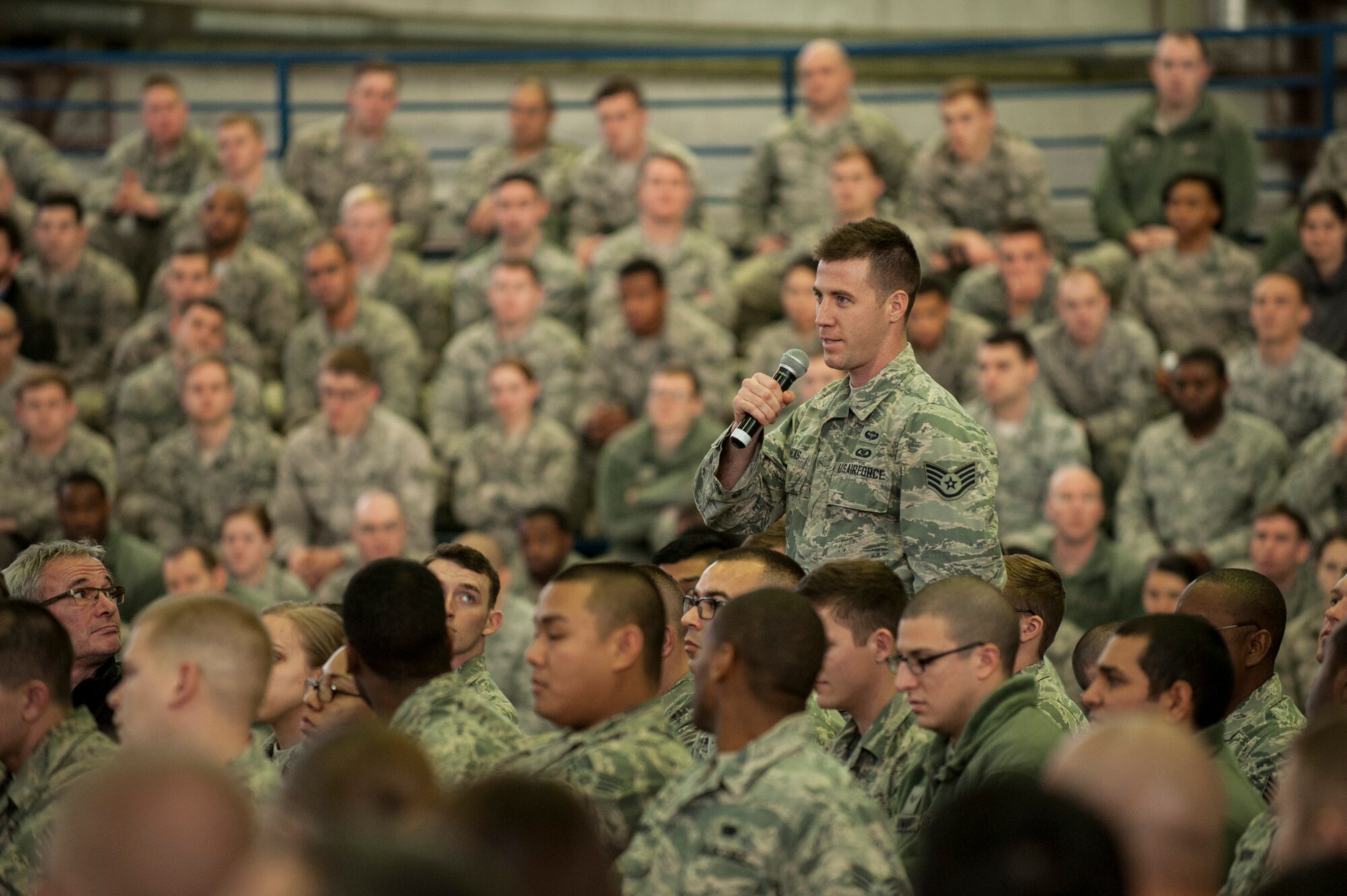 A Spangdahlem Airman asks U.S. Air Force Gen. Frank Gorenc, U.S. Air Forces in Europe and Air Forces Africa commander, a question during an all call inside Hangar 1 at Spangdahlem Air Base, Germany, Dec. 3, 2015. The general visited and spoke with base personnel during his visit. (U.S. Air Force photo by Senior Airman Rusty Frank/Released)