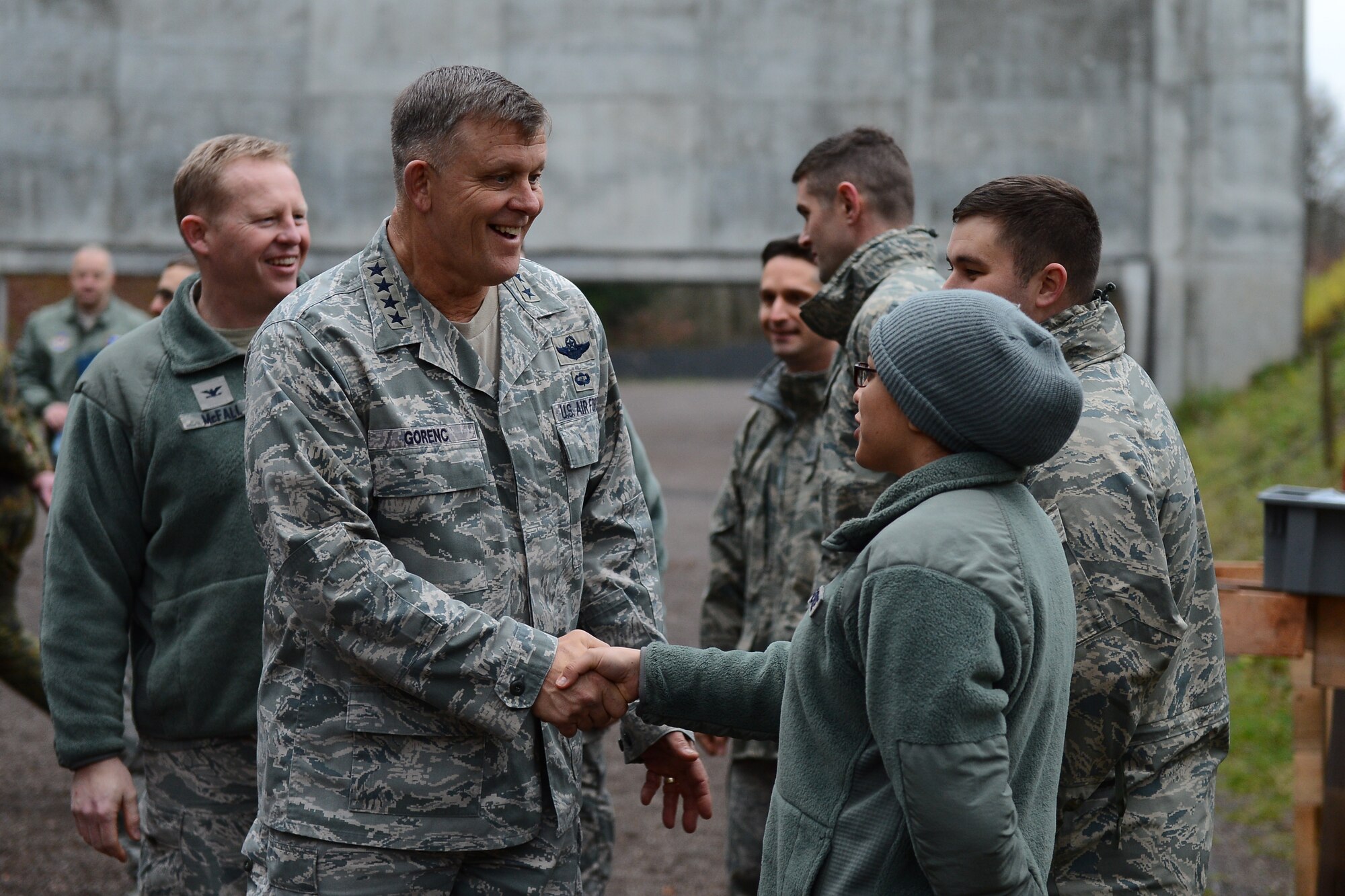 U.S. Air Force Gen. Frank Gorenc, U.S. Air Forces in Europe and Air Forces Africa commander, left, shakes hands with an Airman at the 702nd Munitions Support Squadron in Buechel, Germany, Dec. 3, 2015. Gorenc and U.S. Air Force Chief Master Sgt. James Davis, USAFE- AFAFRICA command chief, provided an all call for Airmen assigned at the 702nd MUNSS.  (U.S. Air Force photo by Airman 1st Class Luke Kitterman)