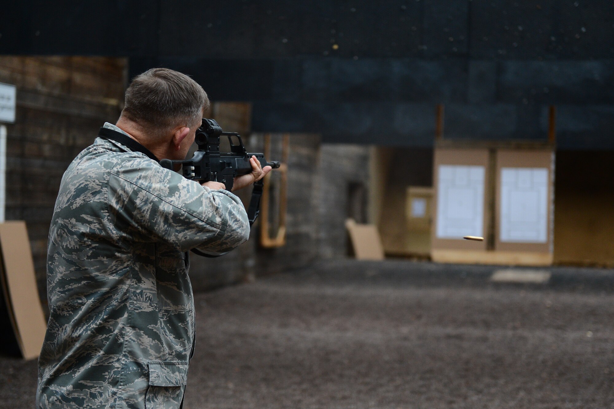 U.S. Air Force Gen. Frank Gorenc, U.S. Air Forces in Europe and Air Forces Africa commander, fires a rifle during target practice at the 702nd Munitions Support Squadron in Buechel, Germany, Dec. 3, 2015. Gorenc and Davis, along with 52nd Fighter Wing leadership, all participated in firing practice while visiting the 702nd MUNSS. (U.S. Air Force photo by Airman 1st Class Luke Kitterman)