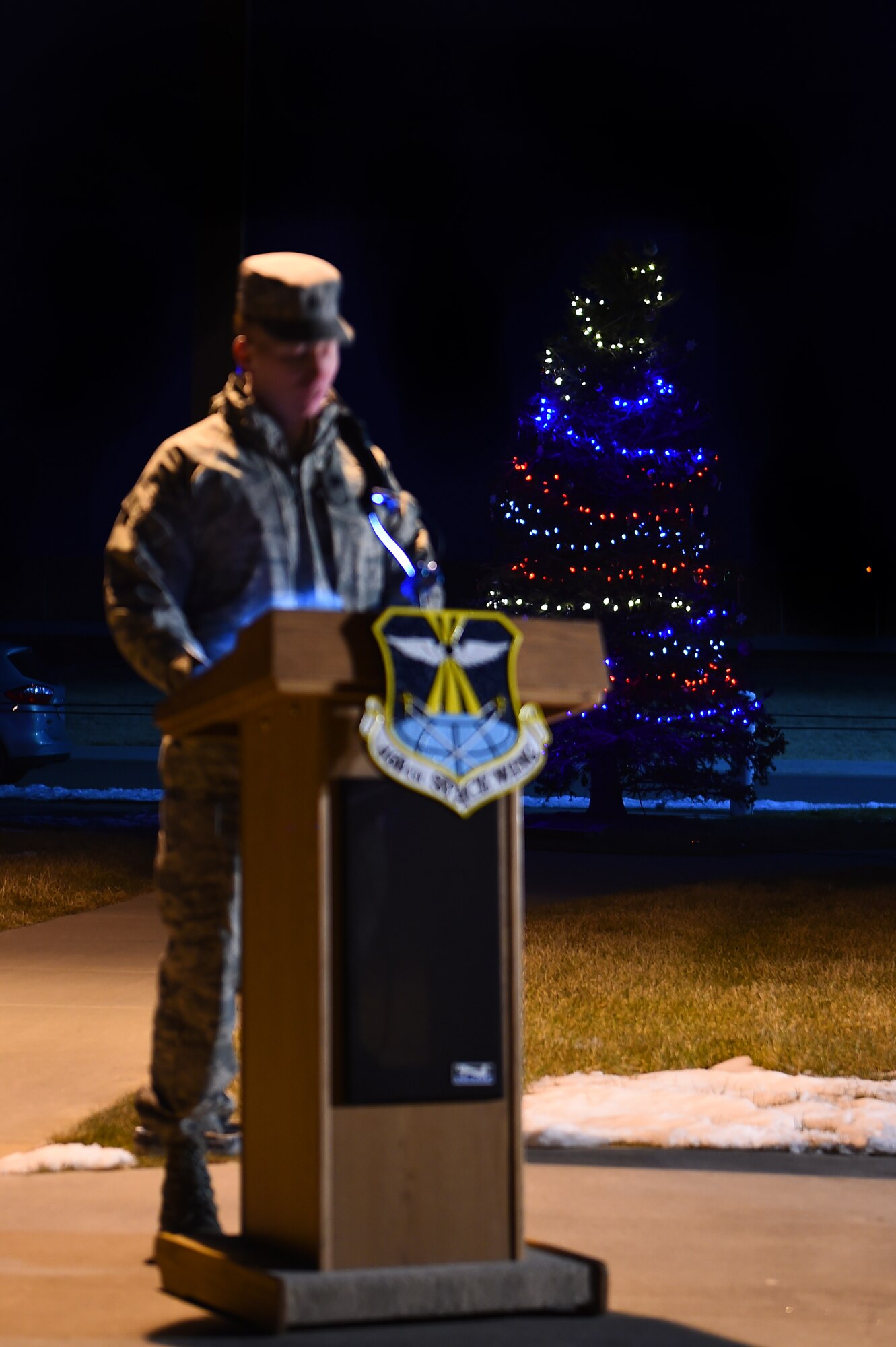 Lt. Col. Christopher Kennedy, 460th Space Communications Squadron commander, speaks during a tree-lighting ceremony Dec. 3, 2015, on Buckley Air Force Base, Colo. The ceremony takes place every year to honor Senior Airman Kristopher Mansfield, who was killed in a drunk driving accident in 2004. (U.S. Air Force photo by Airman First Class Gabrielle Spradling/Released)