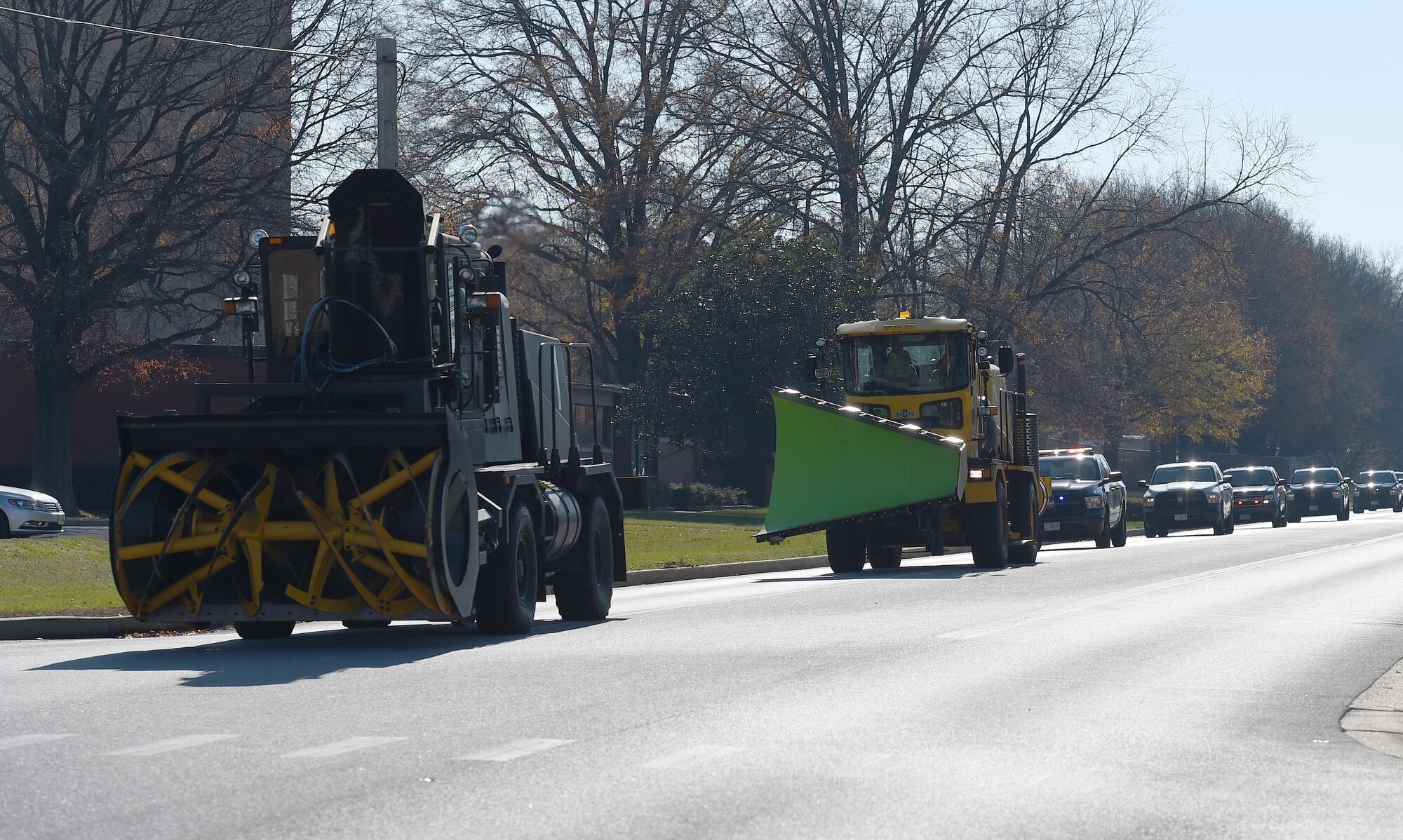 The 11th Civil Engineer Squadron’s snow removal vehicles drive around base during the Snow Parade at Joint Base Andrews, Md., Dec. 4, 2015. The event was held to recognize vital snow preparation efforts in support of the presidential and alert missions at JBA. (U.S. Air Force photo/ Senior Airman Nesha Humes/ released) 
