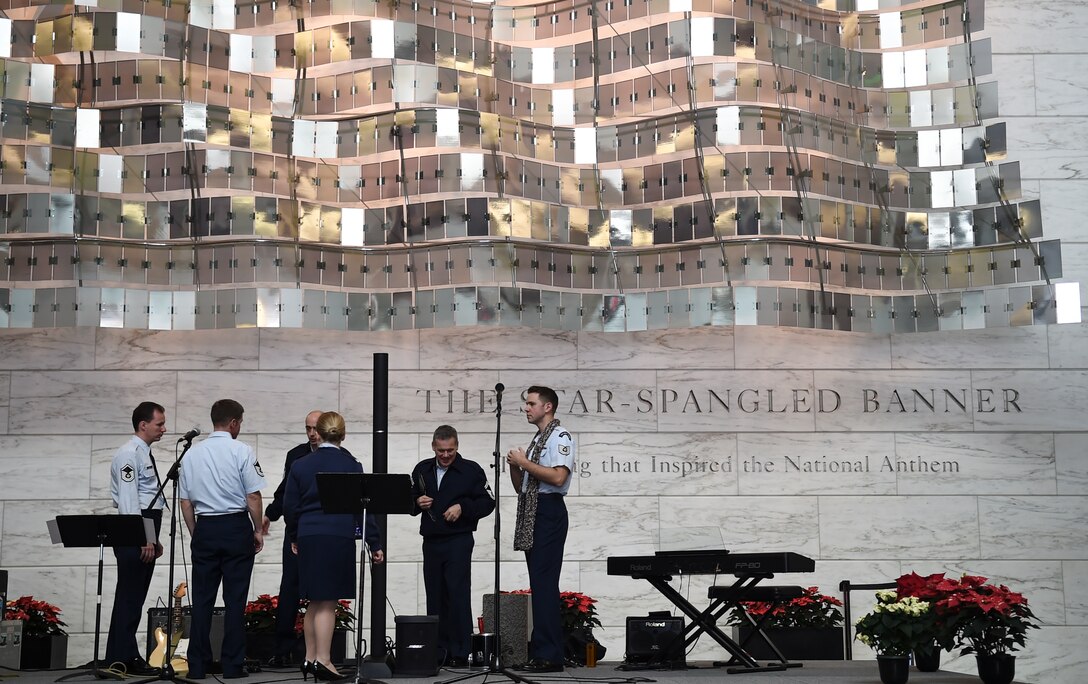 The Singing Sergeants perform during the Smithsonian Holiday Festival at the National Museum of American History, Dec. 5, 2015, in Washington, D.C. The group is one of six musical ensembles that comprise the U.S. Air Force Band, and performed for an audience of approximately 2,000 people. (U.S. Air Force photo by Senior Airman Mariah Haddenham/ Released)