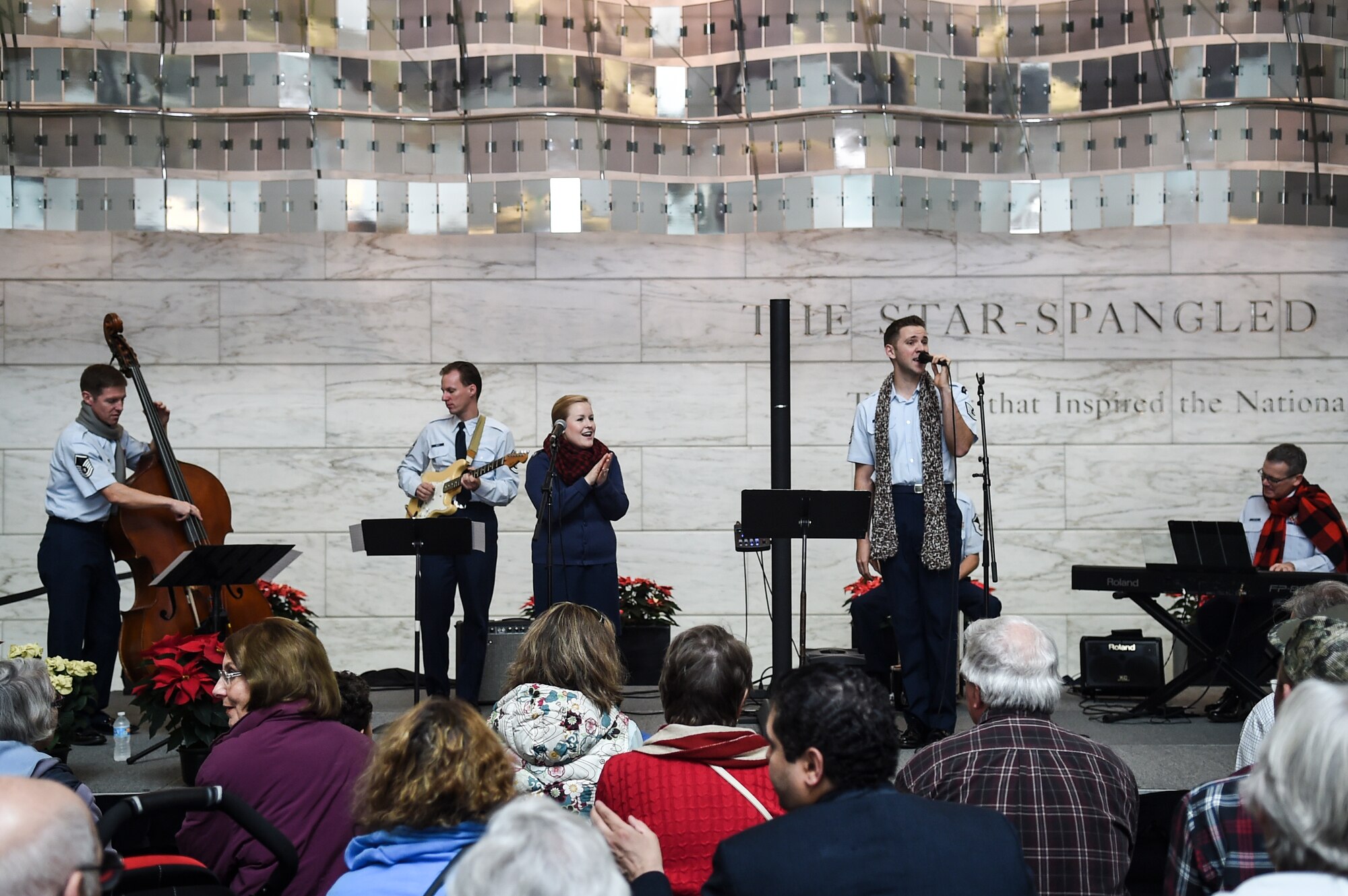 The Singing Sergeants perform during the Smithsonian Holiday Festival at the National Museum of American History, Dec. 5, 2015, in Washington, D.C. The group is one of six musical ensembles that comprise the U.S. Air Force Band, and performed a total of three performances that day. (U.S. Air Force photo by Senior Airman Mariah Haddenham/ Released)