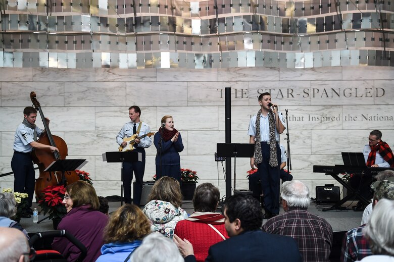 The Singing Sergeants perform during the Smithsonian Holiday Festival at the National Museum of American History, Dec. 5, 2015, in Washington, D.C. The group is one of six musical ensembles that comprise the U.S. Air Force Band, and performed a total of three performances that day. (U.S. Air Force photo by Senior Airman Mariah Haddenham/ Released)
