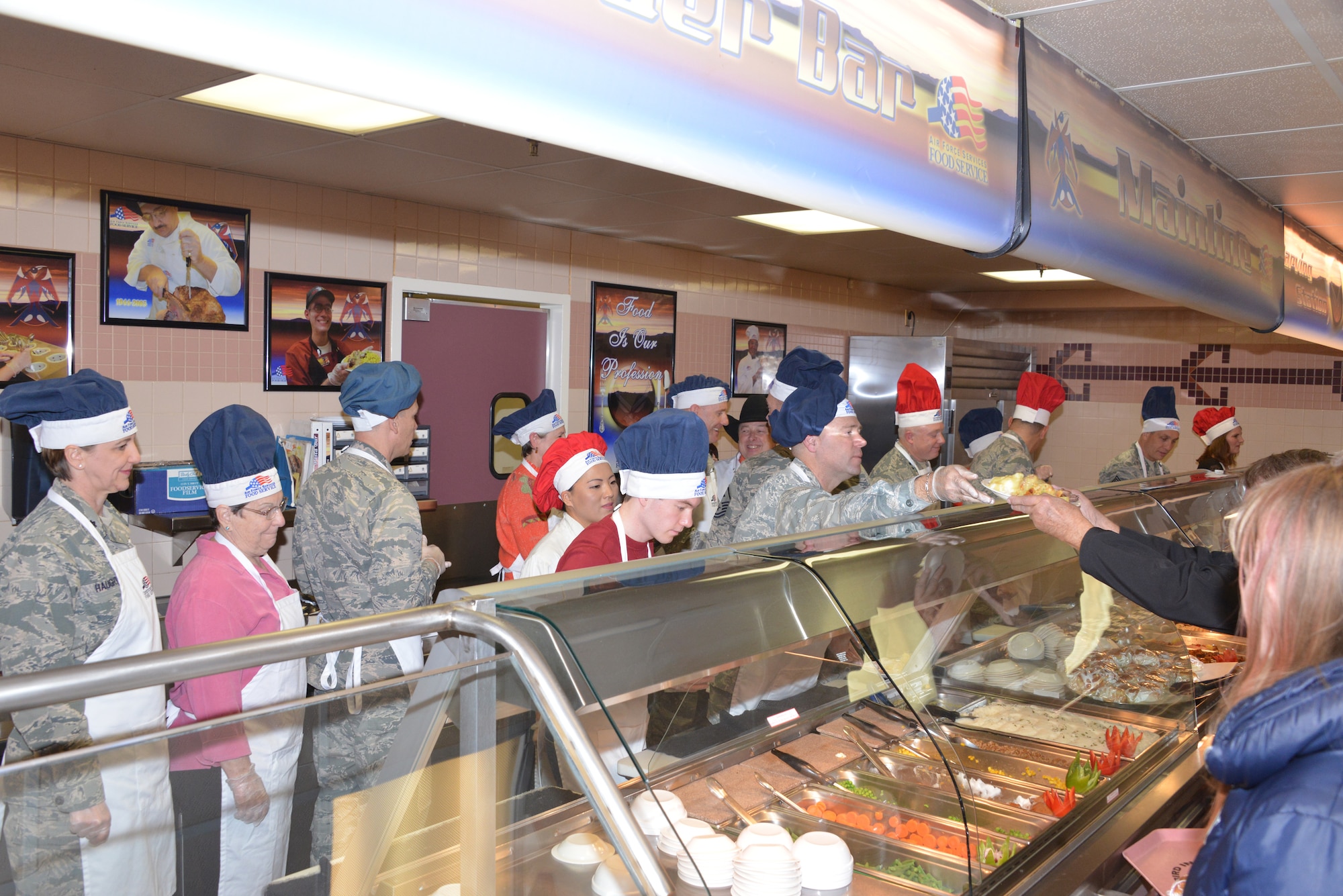 Commanders, chiefs, first sergeants and their spouses served a Thanksgiving meal at Thunderbird Inn Dining Facility on Thanksgiving Day. (Photo by Dennis Carlson) 