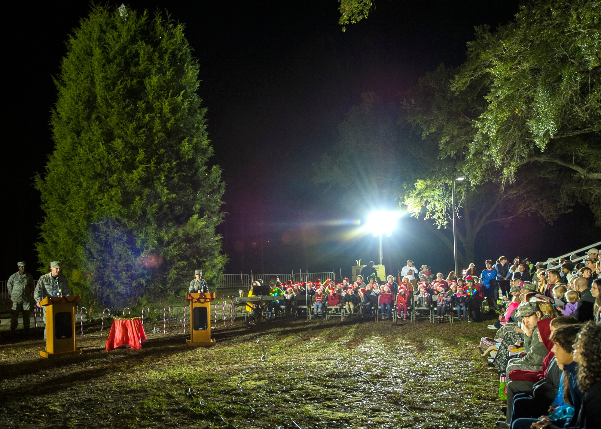 Brig. Gen. Christopher Azzano, 96th Test Wing commander, addresses Eglin’s families during the Christmas tree lighting festivities at the West Gate Chapel Dec. 4 at Eglin Air Force Base, Fla. The commander asked that attendees remember the service men and women deployed in harm’s way this holiday season.  Following the lighting of the tree, Santa Claus arrived by fire truck to listen to the children’s Christmas wishes during the Chapel’s holiday reception. (U.S. Air Force photo/Ilka Cole)