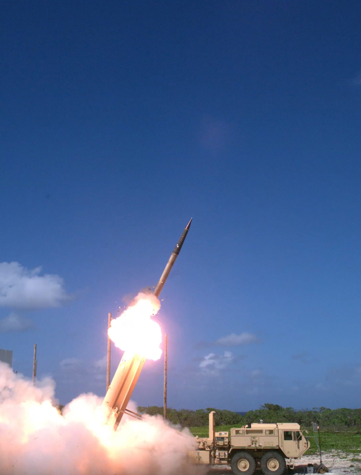 A THAAD weapon system fires from Wake Island in the Pacific Ocean Oct. 31. Edwards personnel helped support the test conducted by the Missile Defense Agency's Ballistic Missile Defense System, which is designed to negate ballistic missile threats. Specifically, this was an operational test of the THAAD weapon system located on Wake Island and the Aegis Ballistic Missile Defense from the Navy’s USS John Paul Jones guided missile destroyer. Southeast of Wake Island, a C-17 supplied by Air Mobility Command launched a Short Range Air Launch Target (SRALT) over the Pacific Ocean that was detected and intercepted by the THAAD weapon system. (Missile Defense Agency image)