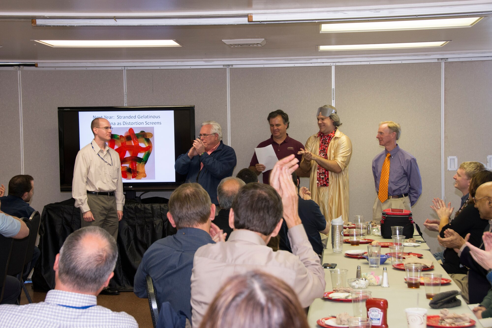 The Tennessee Section of the American Institute of Aeronautics and Astronautics held an Originality Symposium Oct. 30 at the University of Tennessee Space Institute, during which original scientific theories were presented. Many attended this meeting to witness the interesting, and at times humorous, presentations. The presenters were Eric Jacobs with a theory entitled, “Dreams of Oberth: Rapid Solar Escape through the Sun”; Monty Smith with, “Evolutionary Mysteries Regarding Native Avian Species in Southern Middle Tennessee”; Taylor Swanson with the “Scientific Analysis of ‘Ghostbusters’”; and Robert Hiers with “The Pros and Cons of Gelatinous Ursidae as Humidity Sensors.” AIAA members pictured left to right are Taylor Swanson, Robert Hiers, AIAA Section Chair Joseph Sheely, Eric Jacobs and Monty Smith. (U.S. Air Force Photo/Jacqueline Cowan)