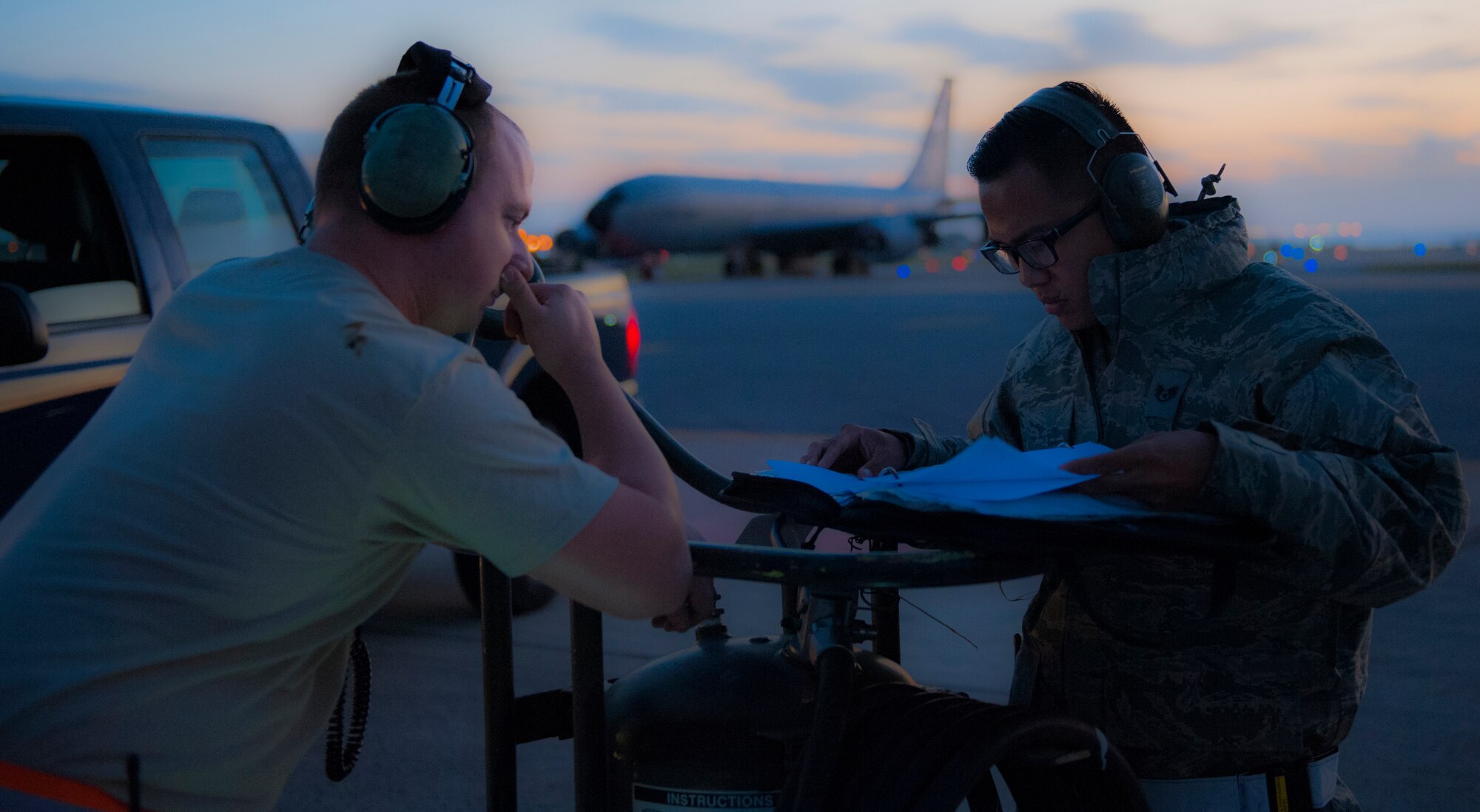 U.S. Air Force Staff Sgt. Chirstopher Anderson (left), 909th Aircraft Maintenance Unit crew chief, undergoes an active forms review from Staff Sgt. Andre Pagtalunan, 18th Maintenance Group quality assurance inspector, Dec. 7, 2015, at Kadena Air Base, Japan. The inspection ensures a high quality of work and safety for the Airmen on the flight line. (U.S. Air Force photo by Airman Zackary A. Henry)