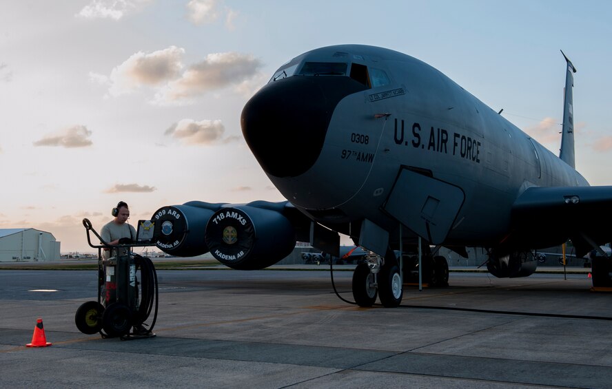 U.S. Air Force Staff Sgt. Chirstopher Anderson, 909th Aircraft Maintenance Unit crew chief, reviews his technical orders during a routine ground refueling, Dec. 7, 2015, at Kadena Air Base, Japan. Technical orders are guides for repairing, maintaining and performing daily duties for maintainers to ensure consistent aircraft care throughout the Air Force. (U.S. Air Force photo by Airman Zackary A. Henry)